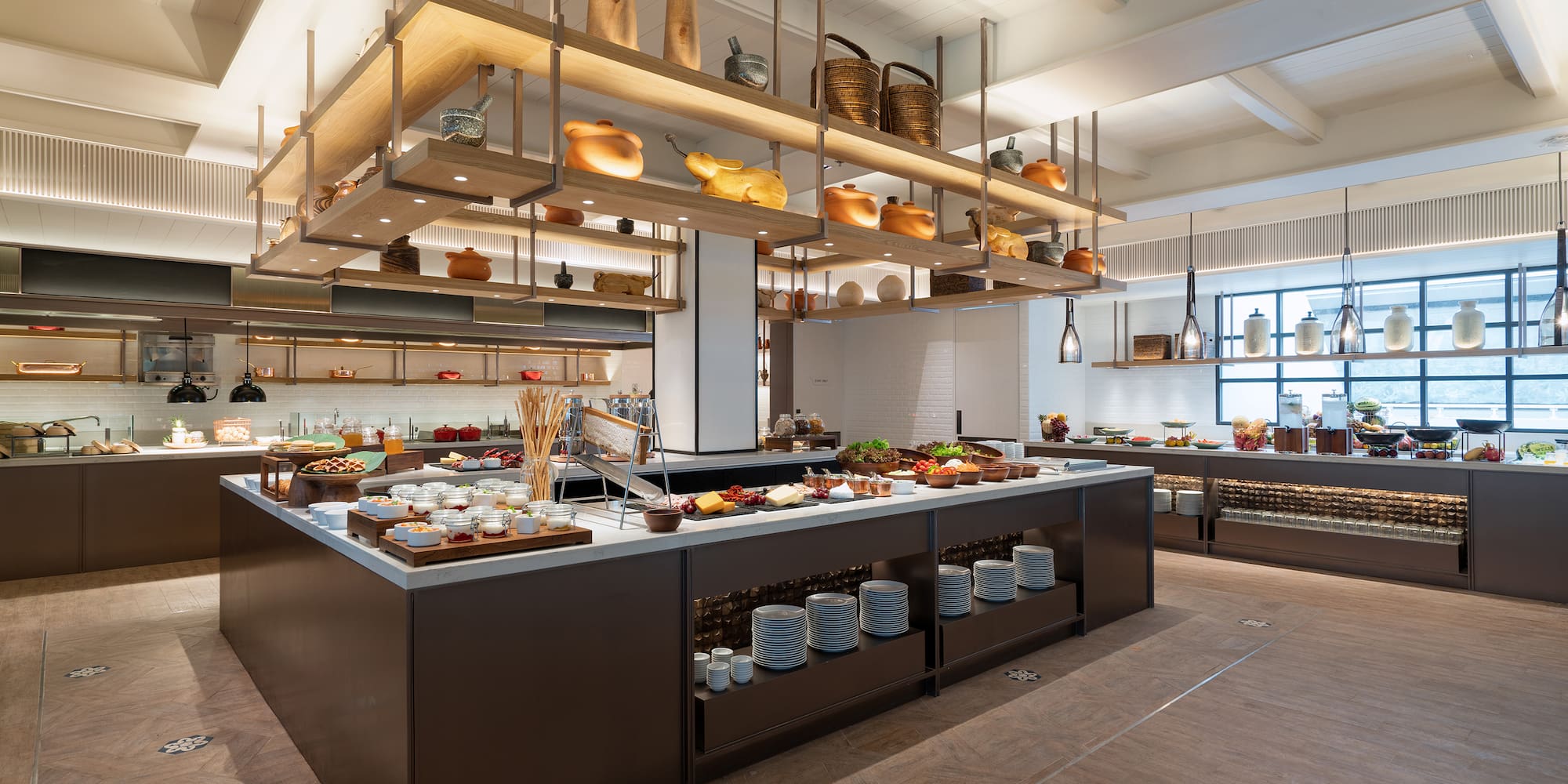 a large kitchen with food on shelves