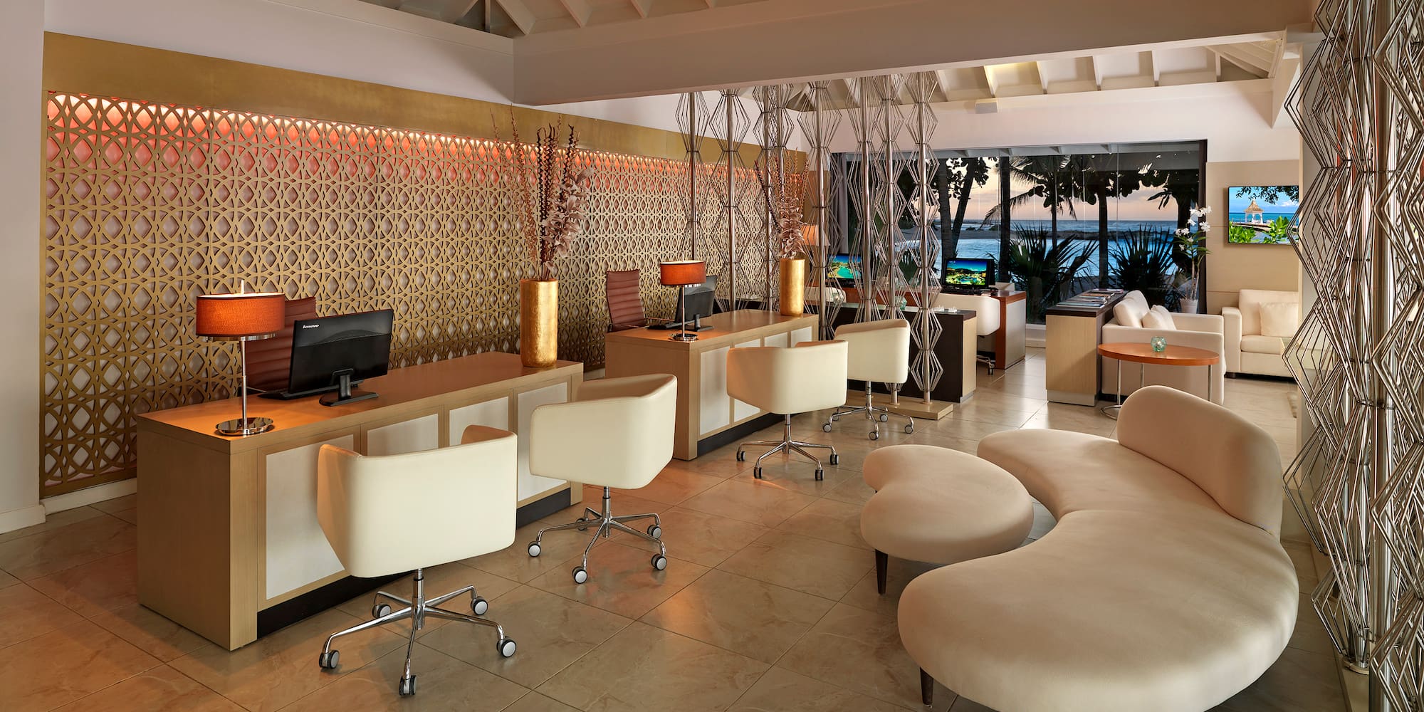 a room with a computer and a couch