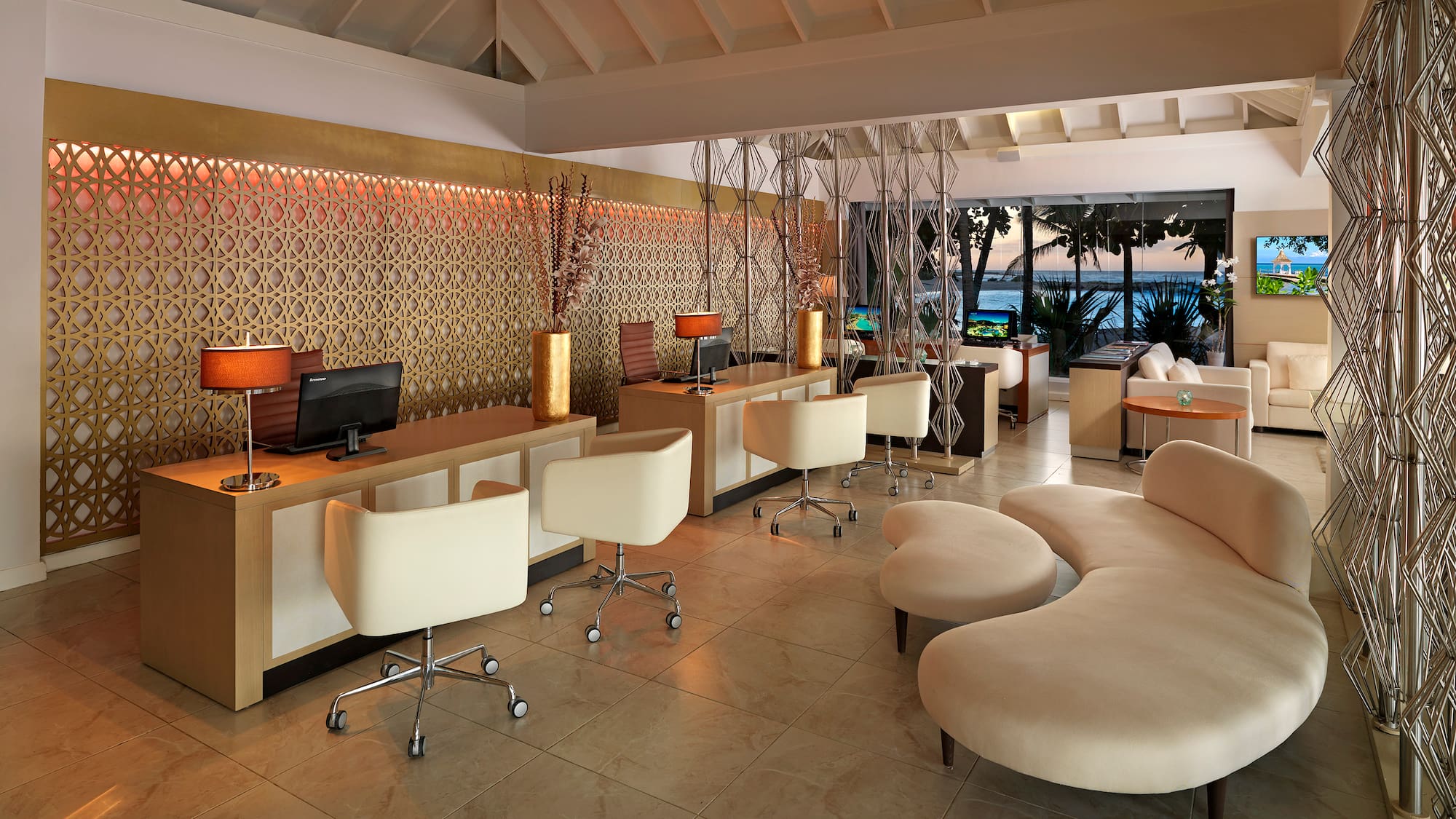 a room with a computer and a couch