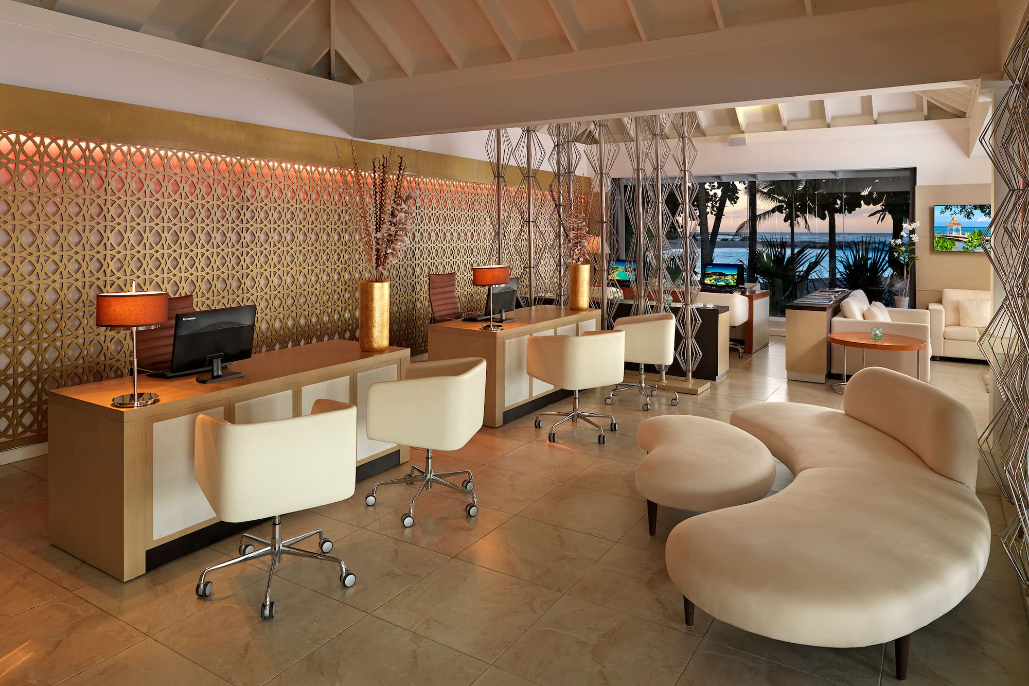 a room with a computer and a couch