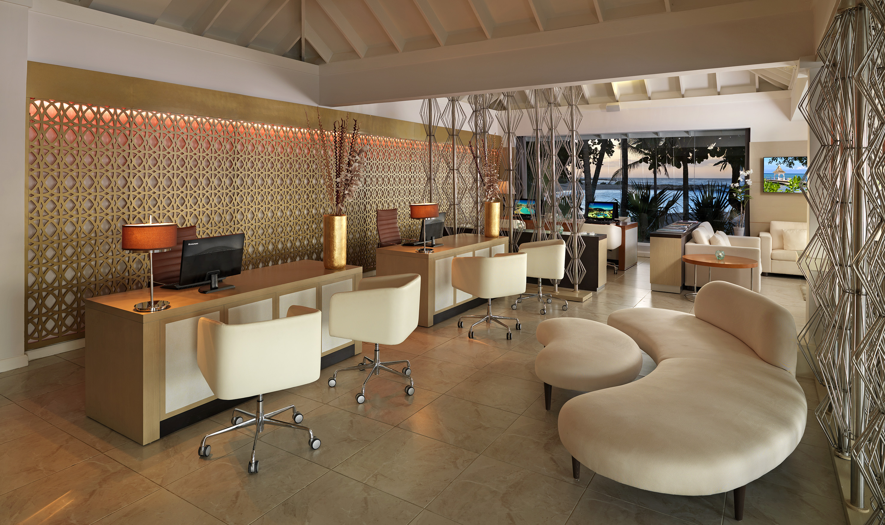 a room with a computer and a couch