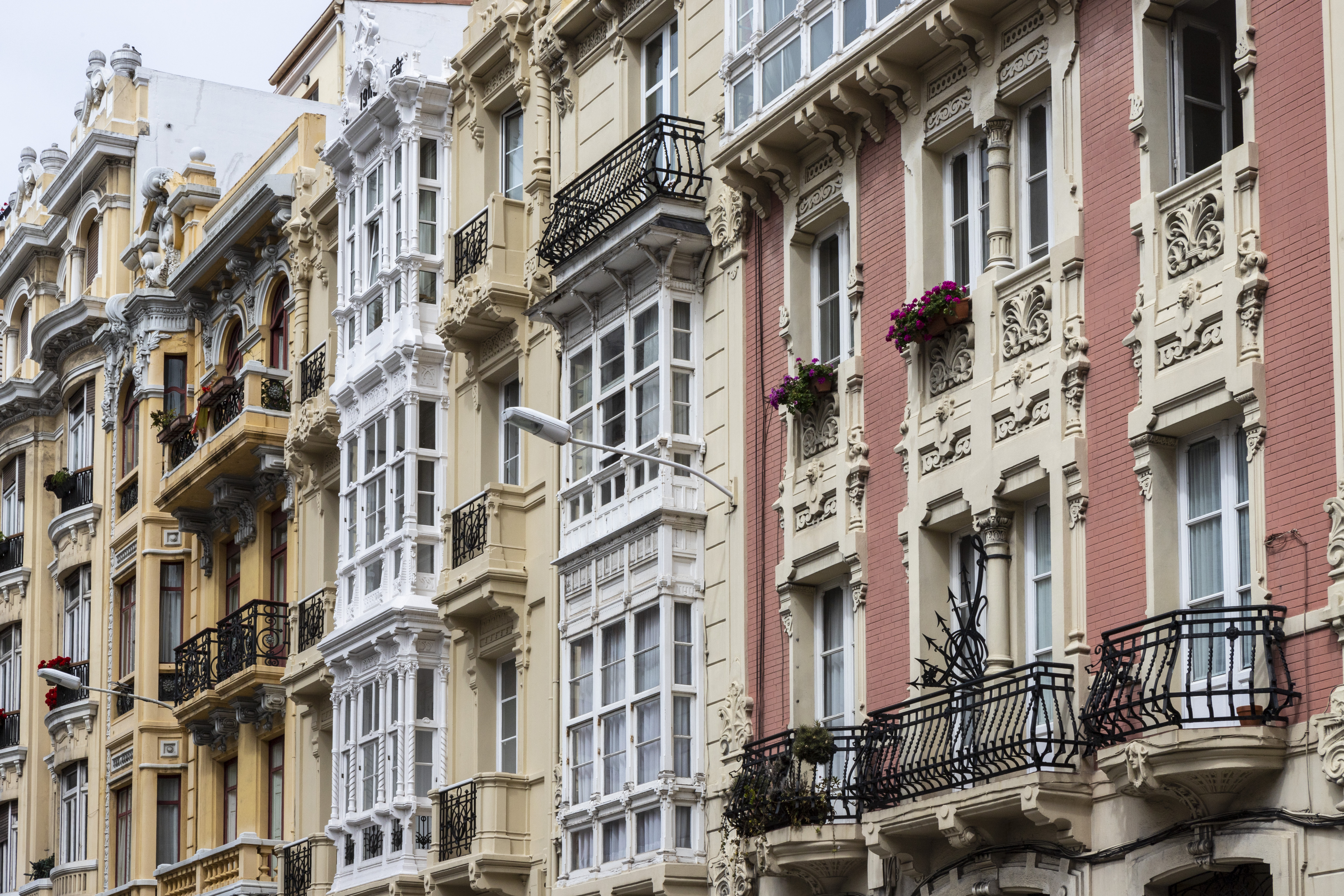 a row of buildings with balconies