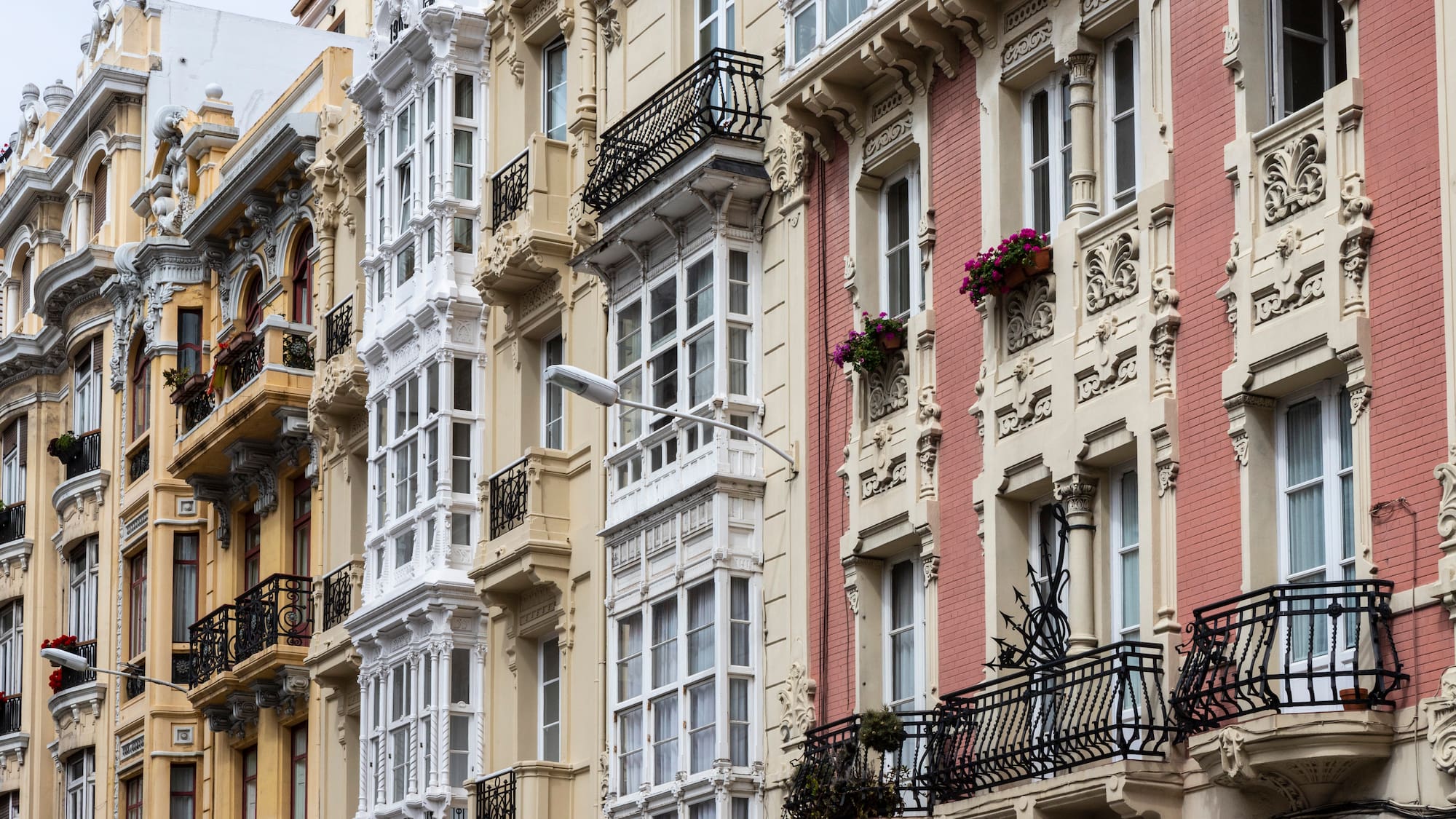 a row of buildings with balconies