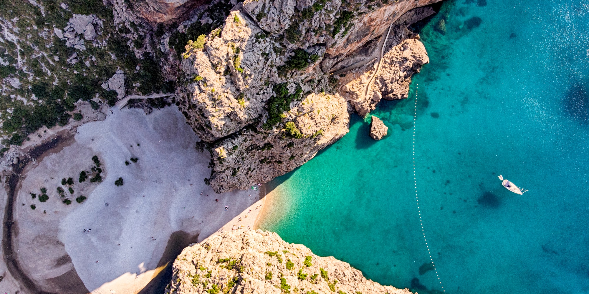 a body of water and rocky cliffs