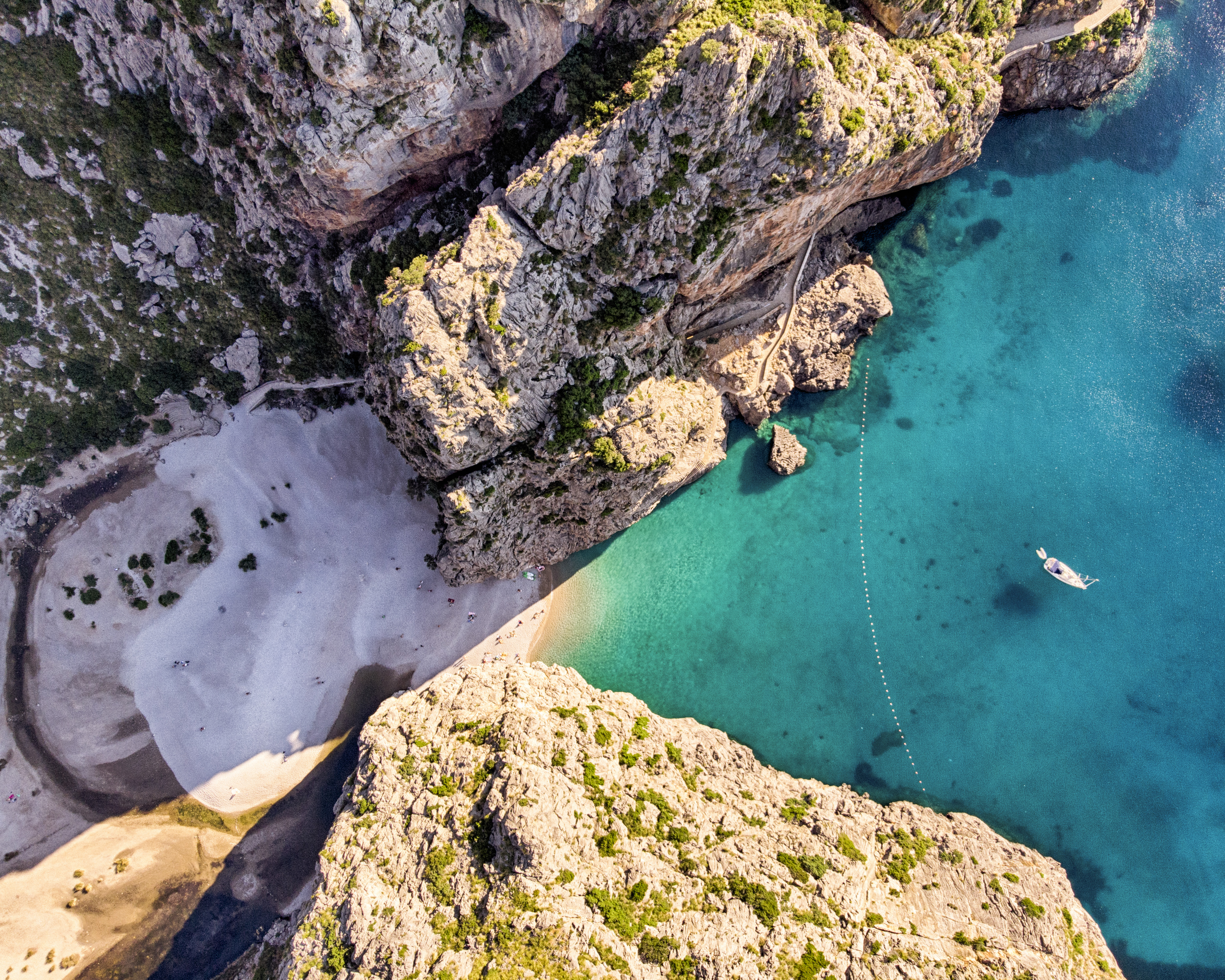 a body of water and rocky cliffs