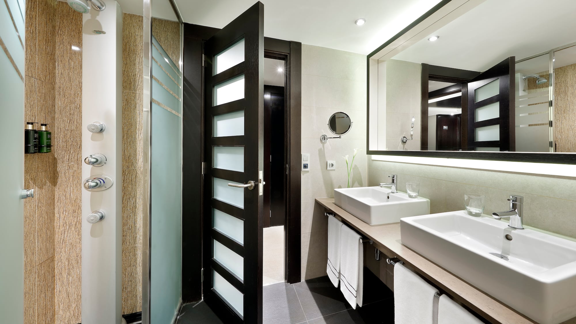 a bathroom with a shower and sink