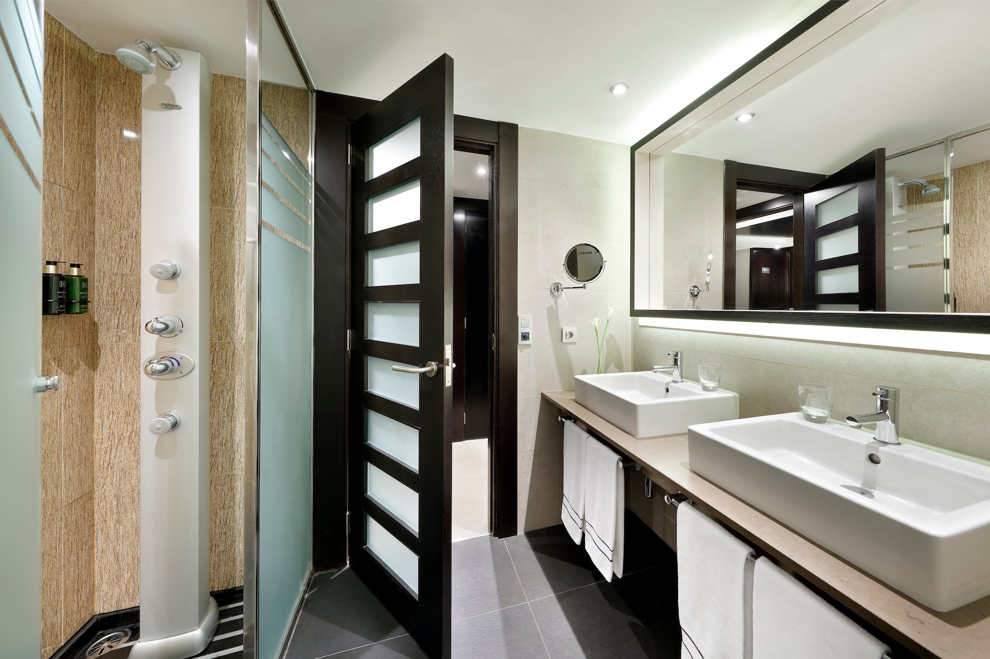 a bathroom with a shower and sink