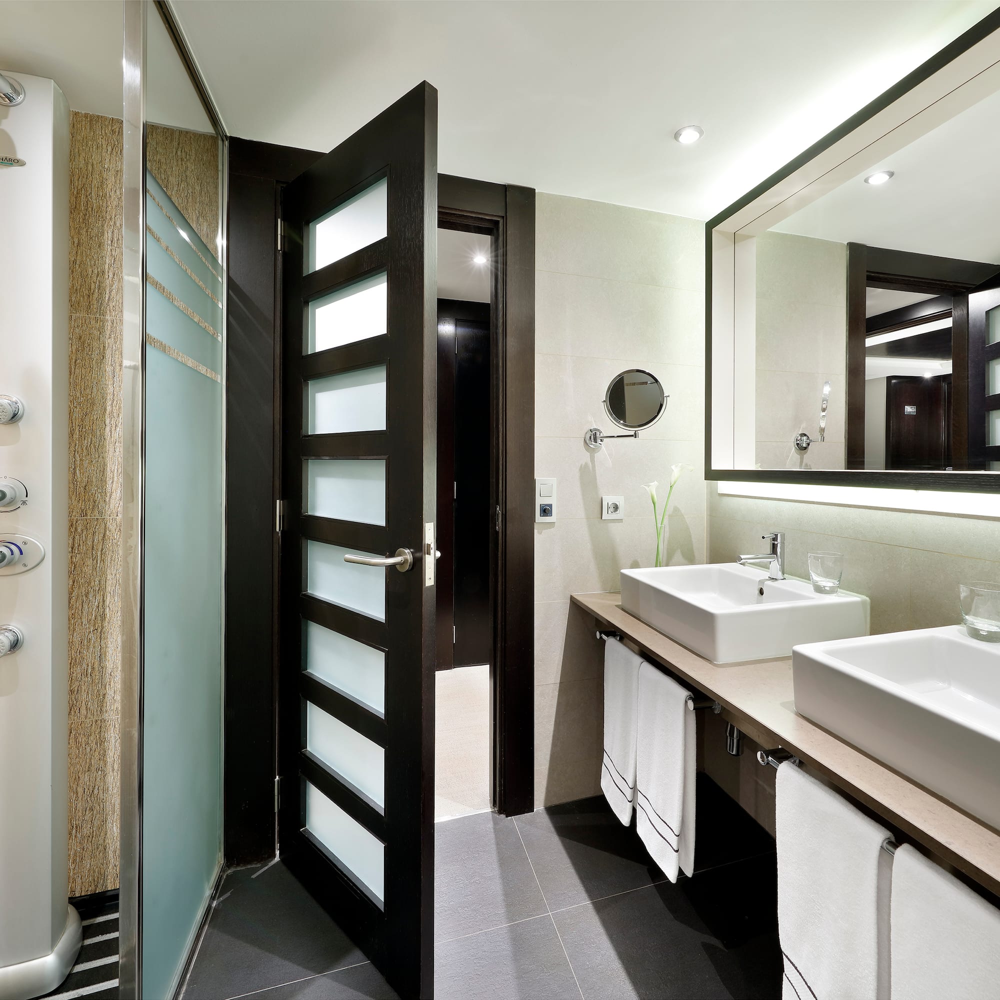 a bathroom with a shower and sink