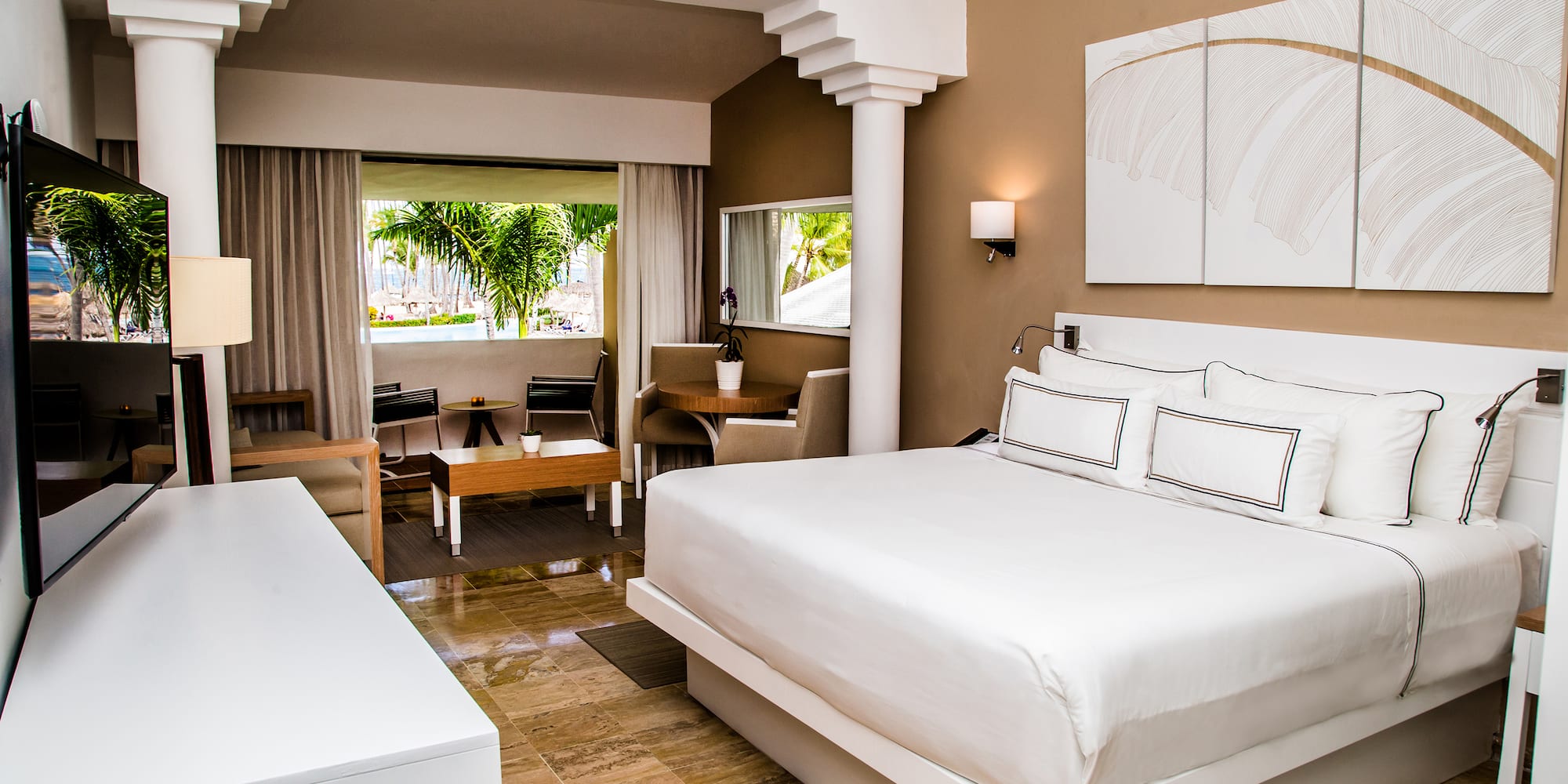 a bedroom with a bed and a table