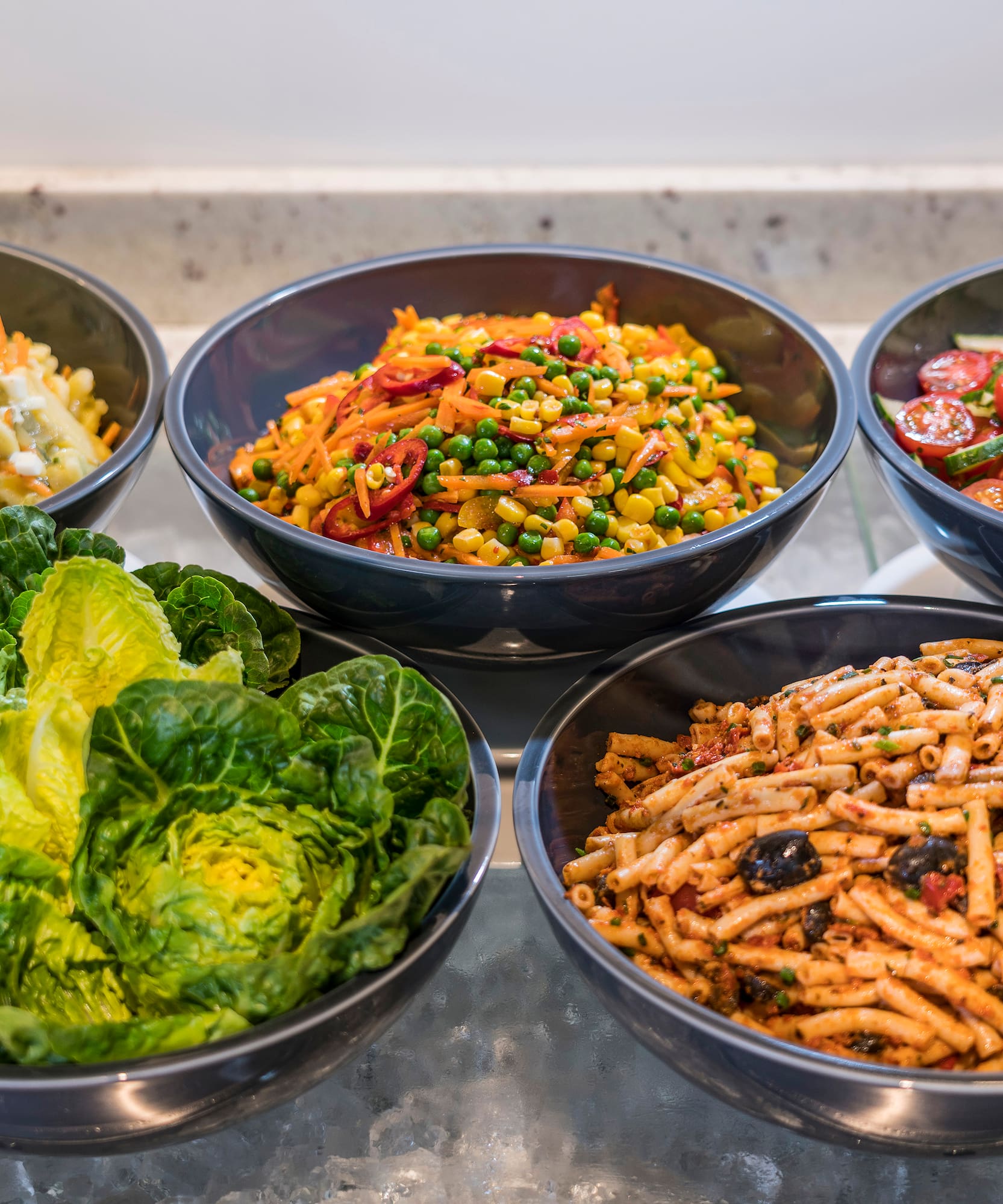 a group of bowls of food