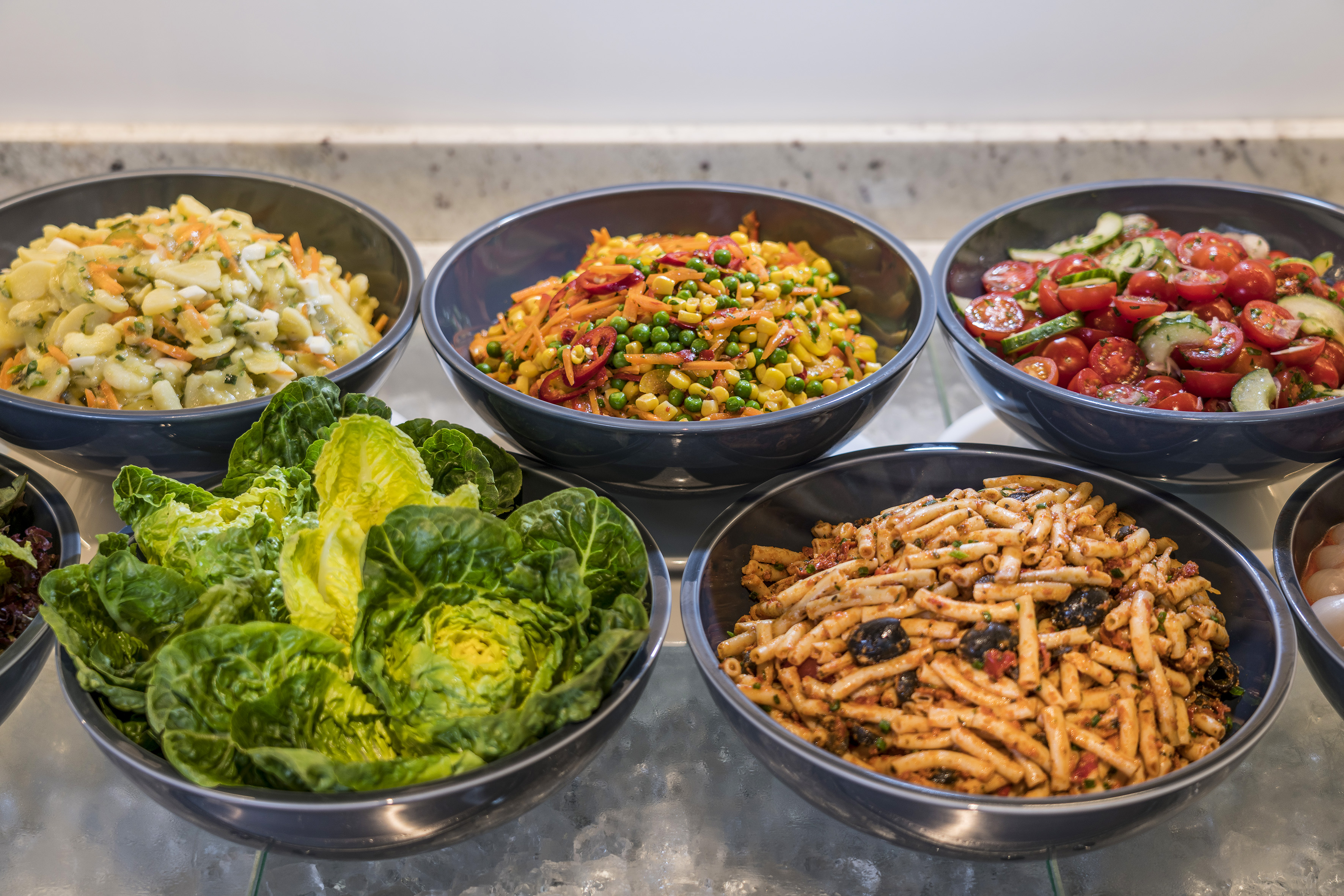 a group of bowls of food