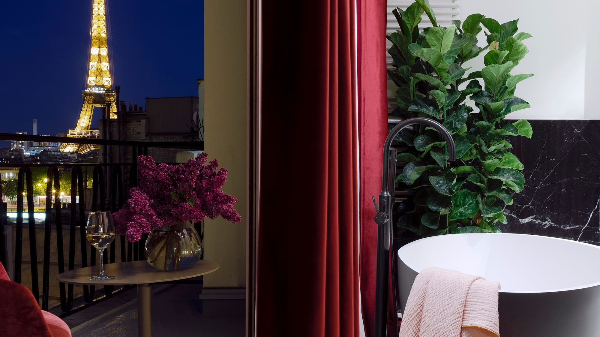 a bathroom with a tub and a red curtain