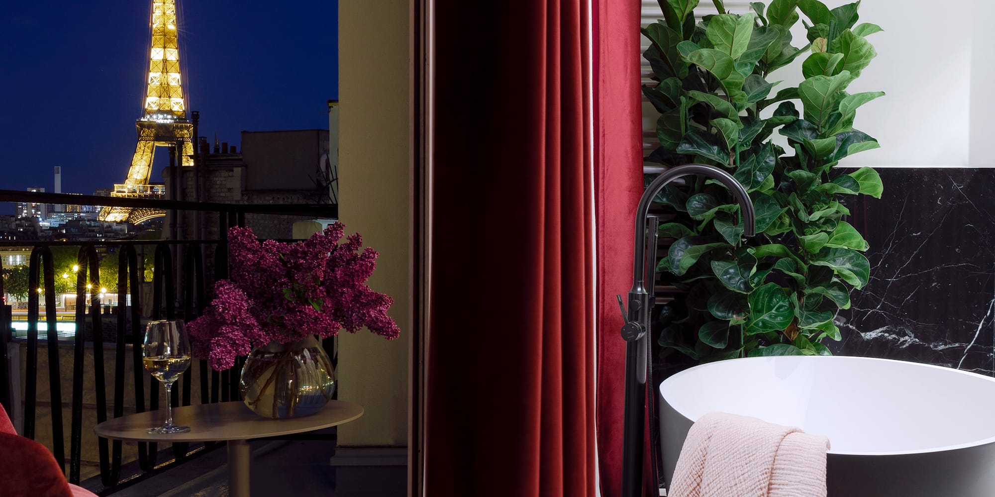 a bathroom with a tub and a red curtain