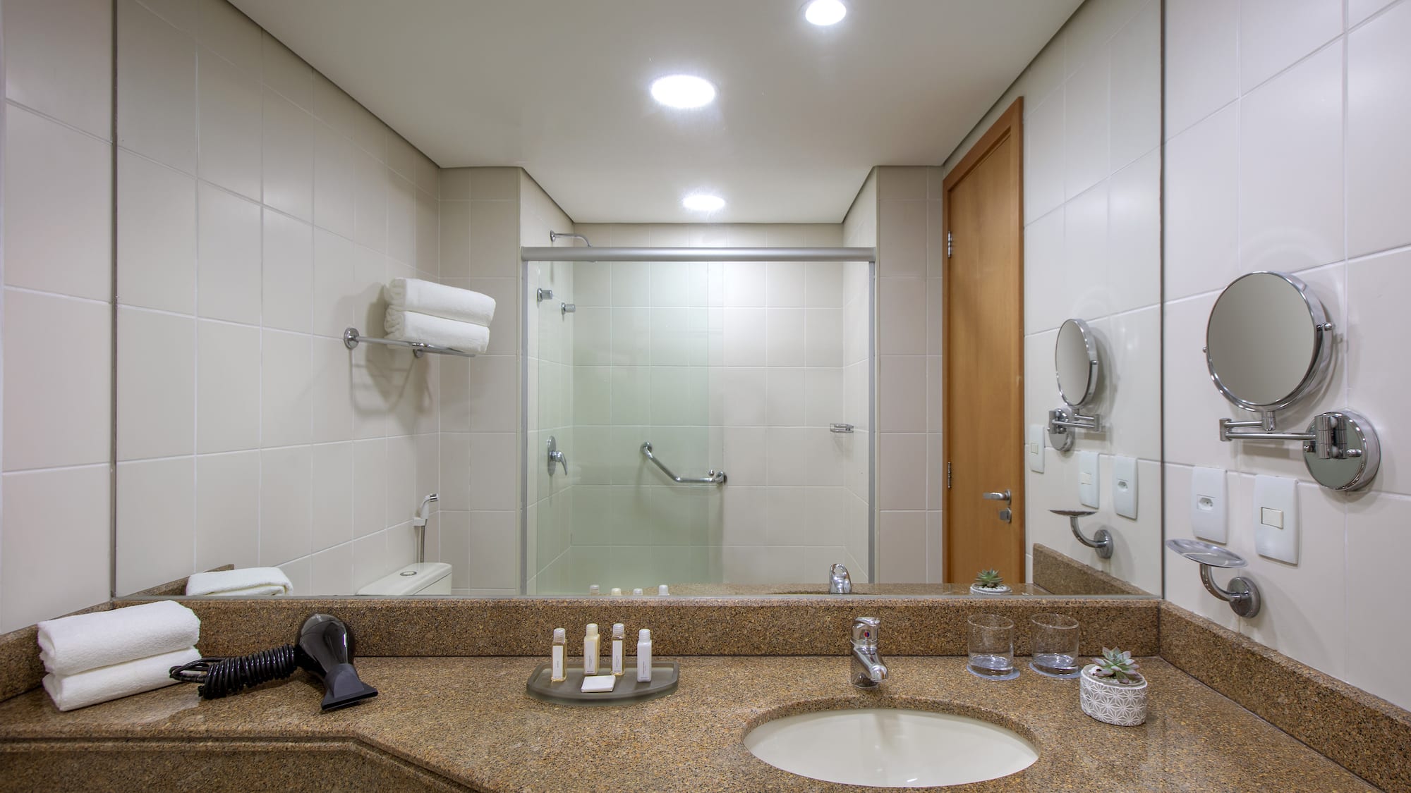 a bathroom with a mirror and sink