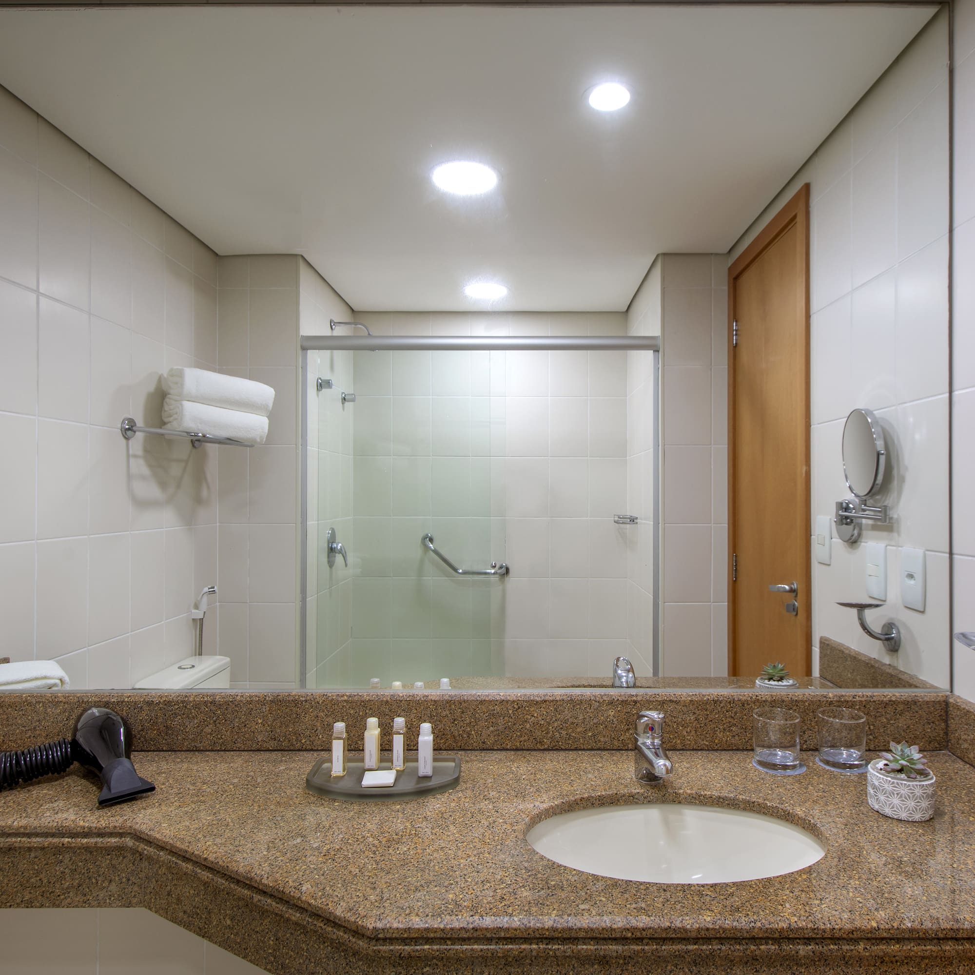 a bathroom with a mirror and sink