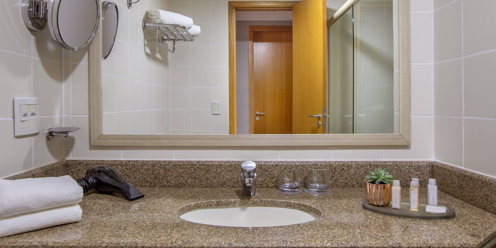 a bathroom with a mirror and a sink