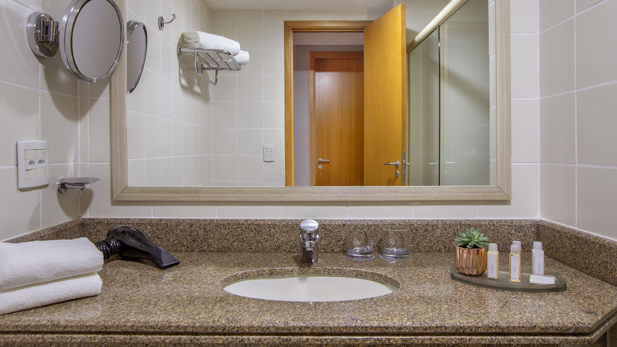 a bathroom with a mirror and a sink