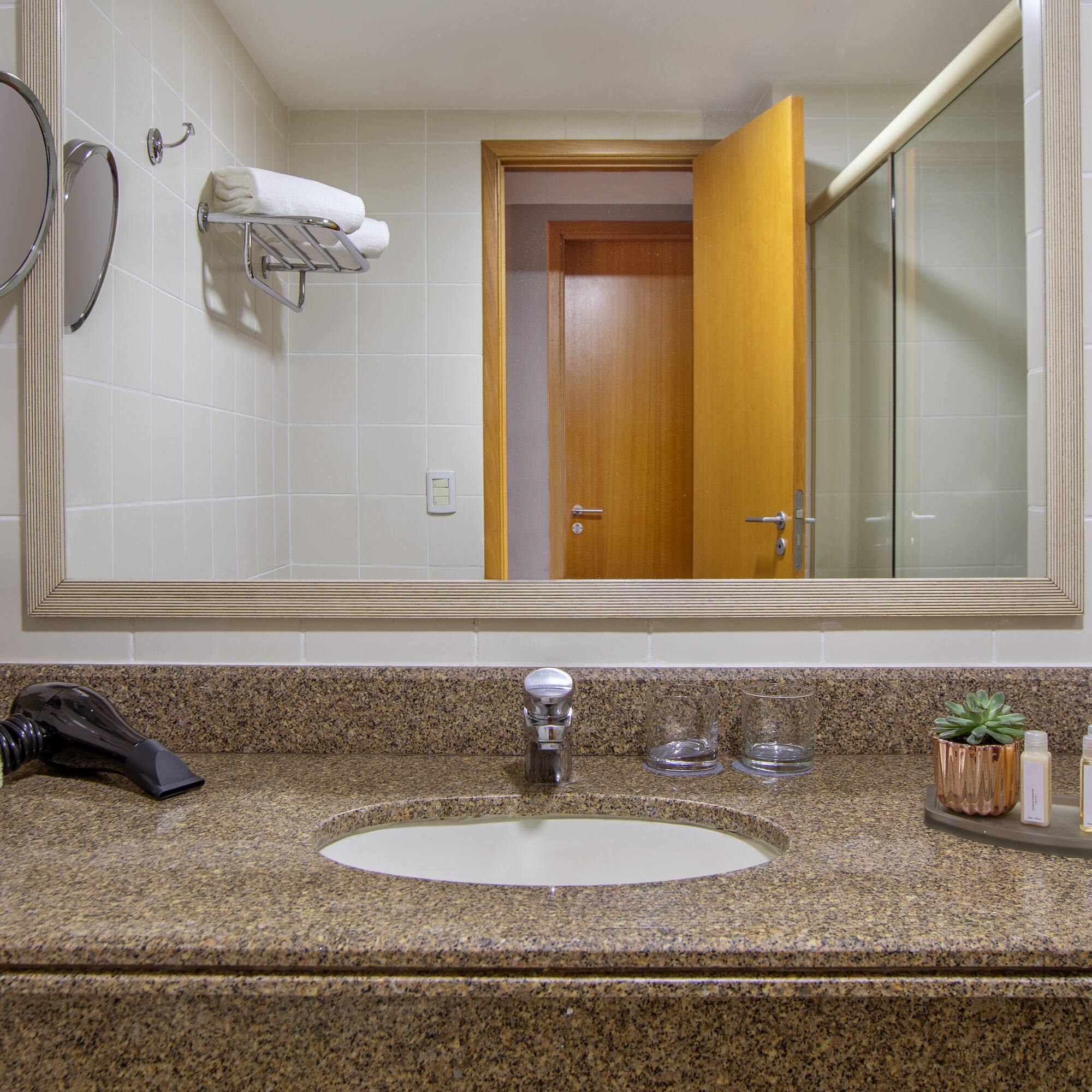 a bathroom with a mirror and a sink