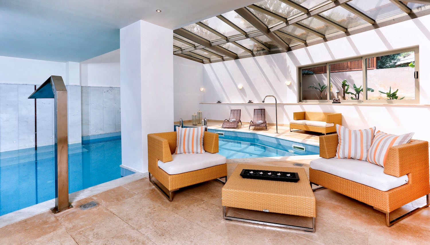 a pool with chairs and a table