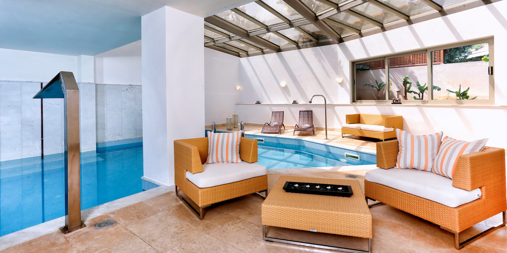 a pool with chairs and a table