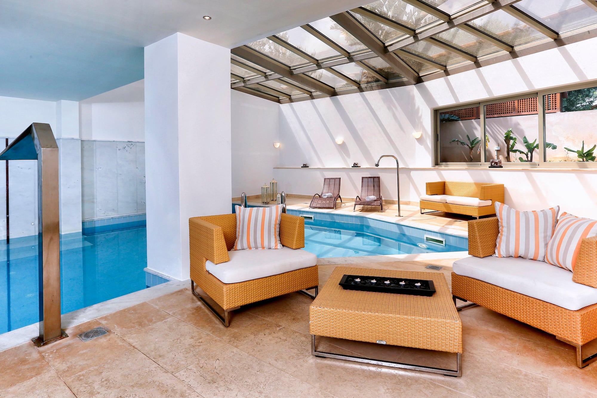 a pool with chairs and a table