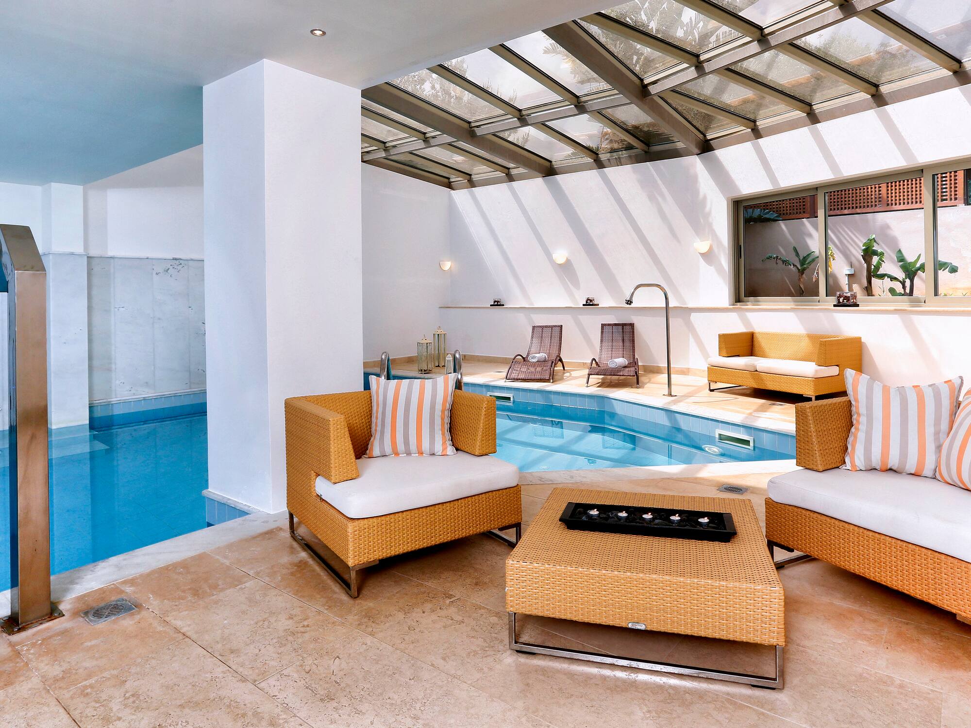 a pool with chairs and a table