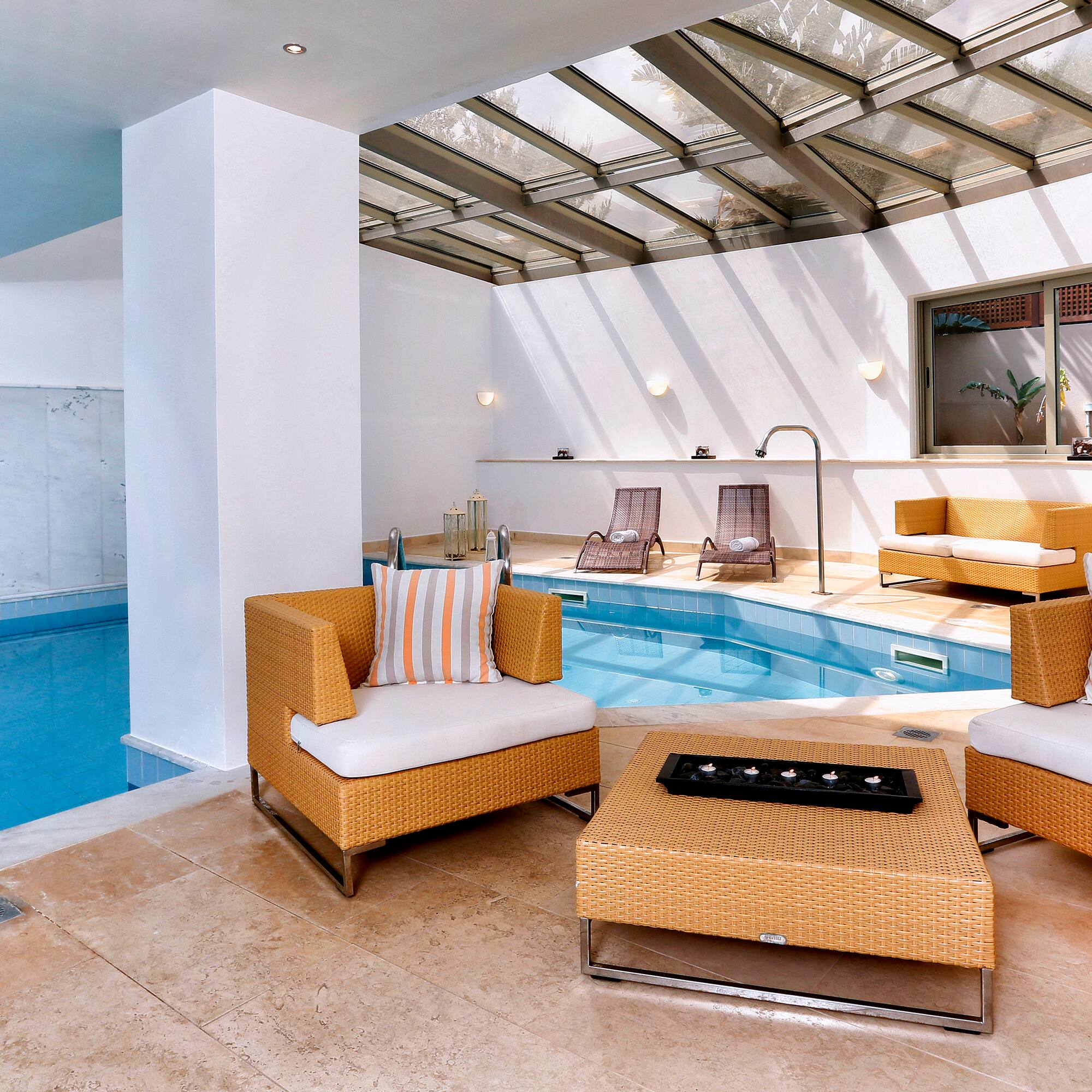 a pool with chairs and a table