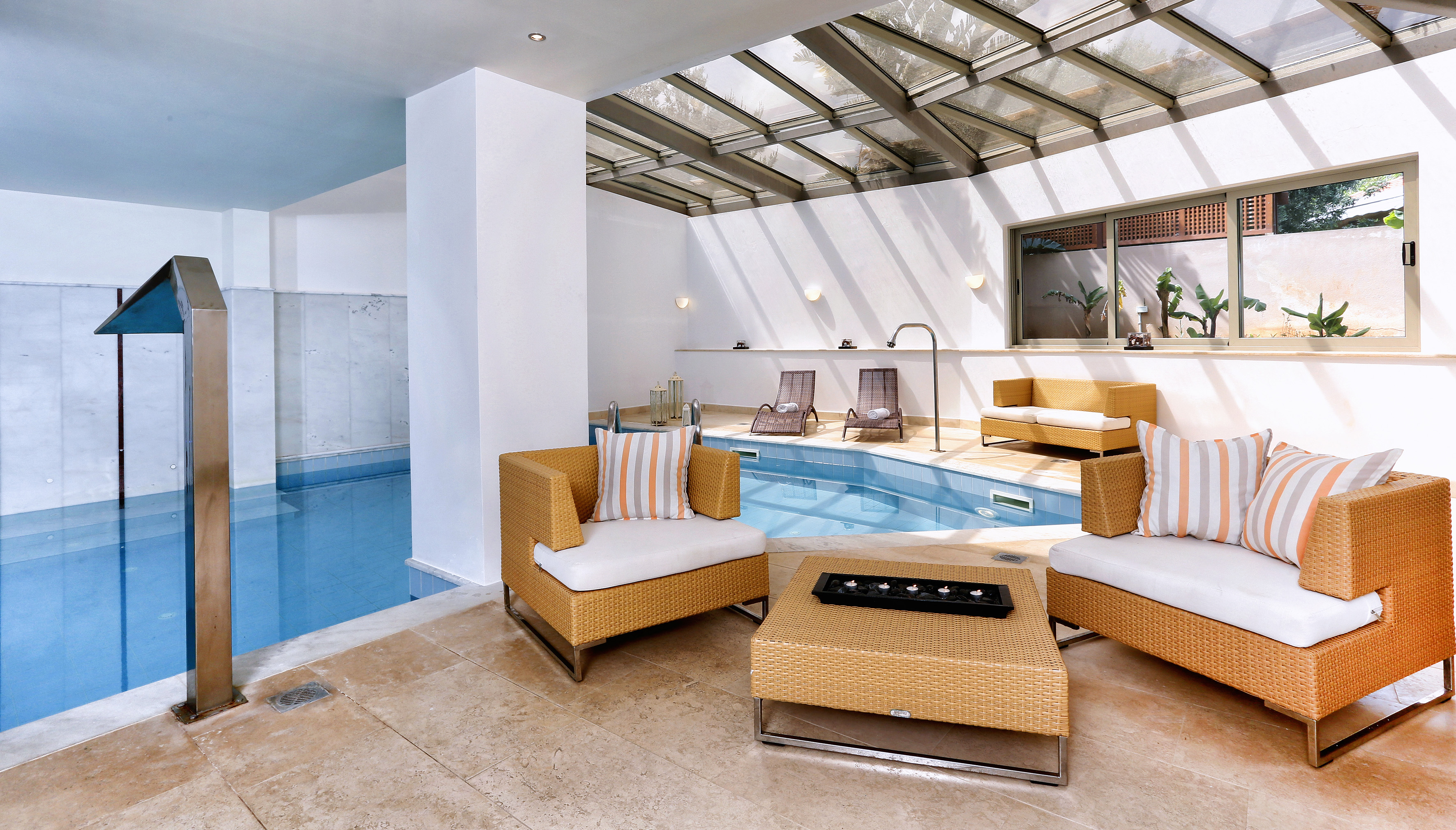 a pool with chairs and a table