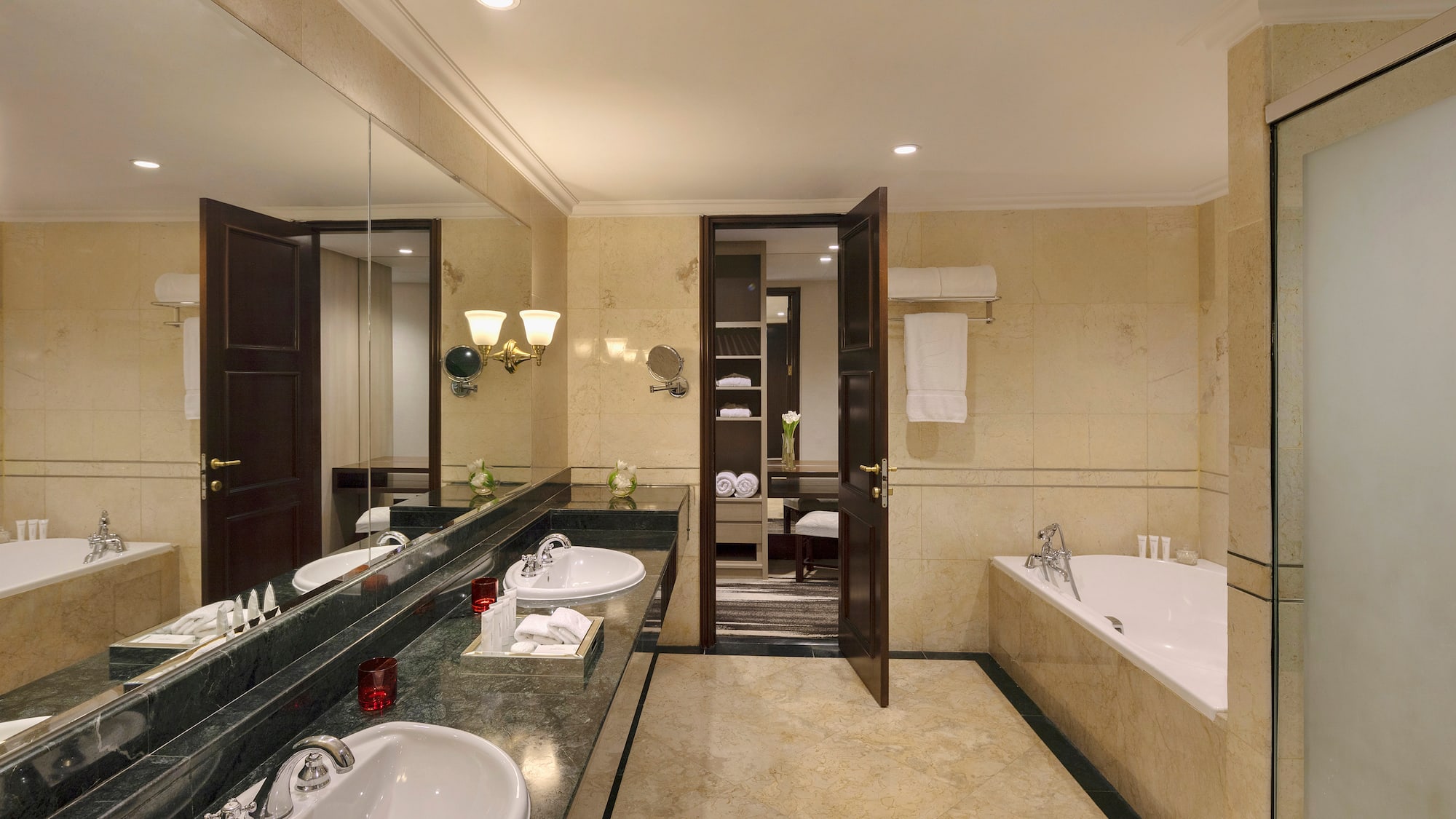 a bathroom with marble counter tops and sinks