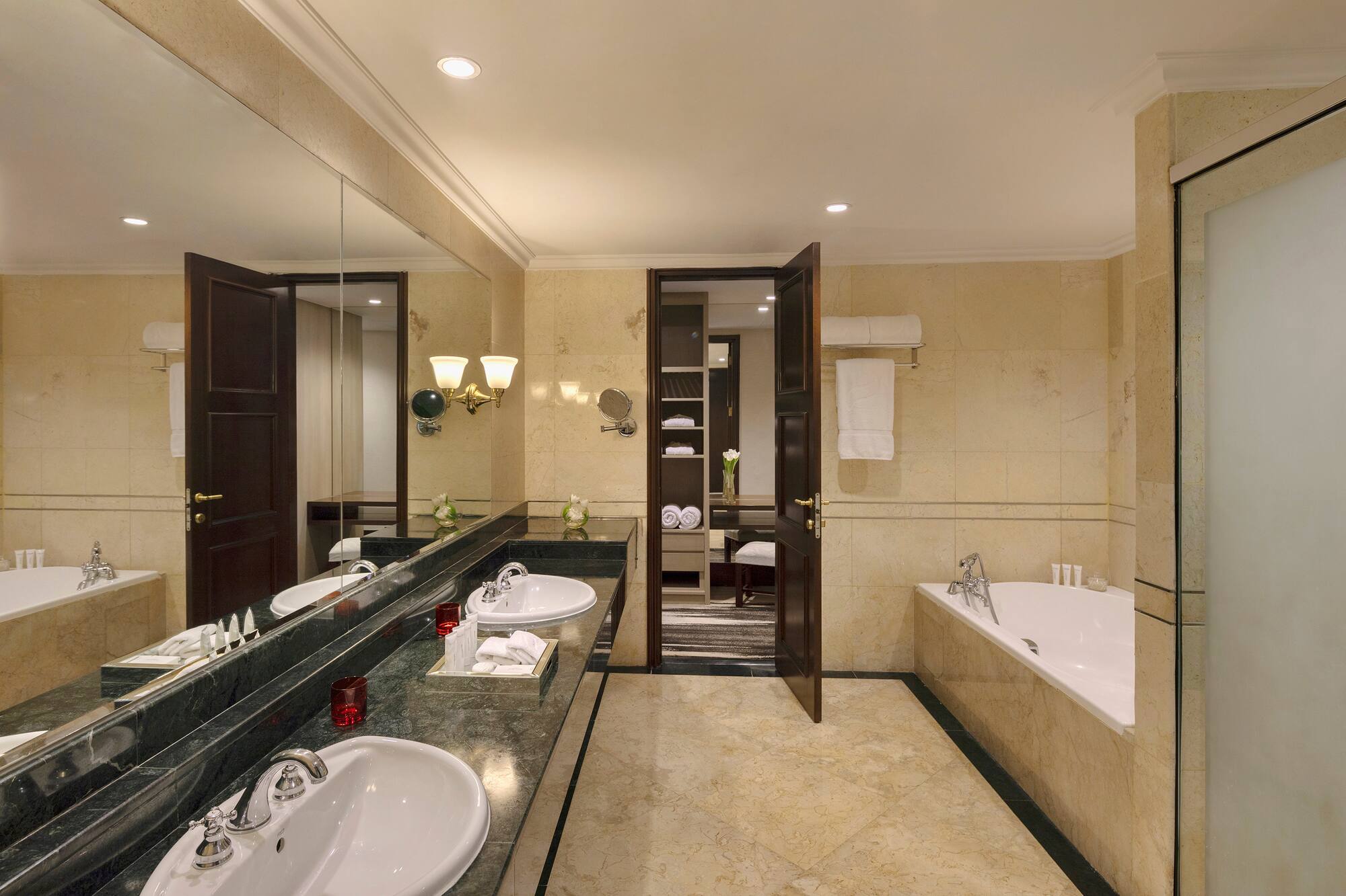 a bathroom with marble counter tops and sinks
