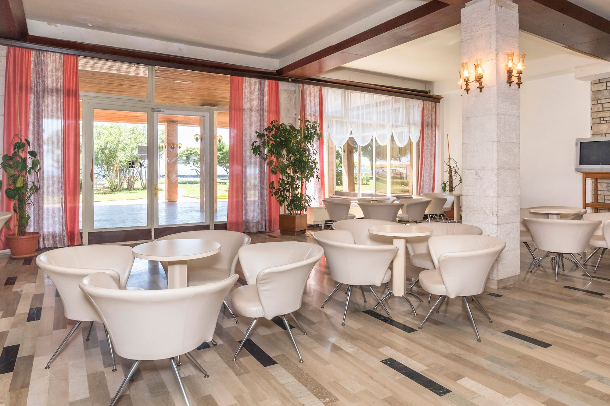 a room with tables and chairs