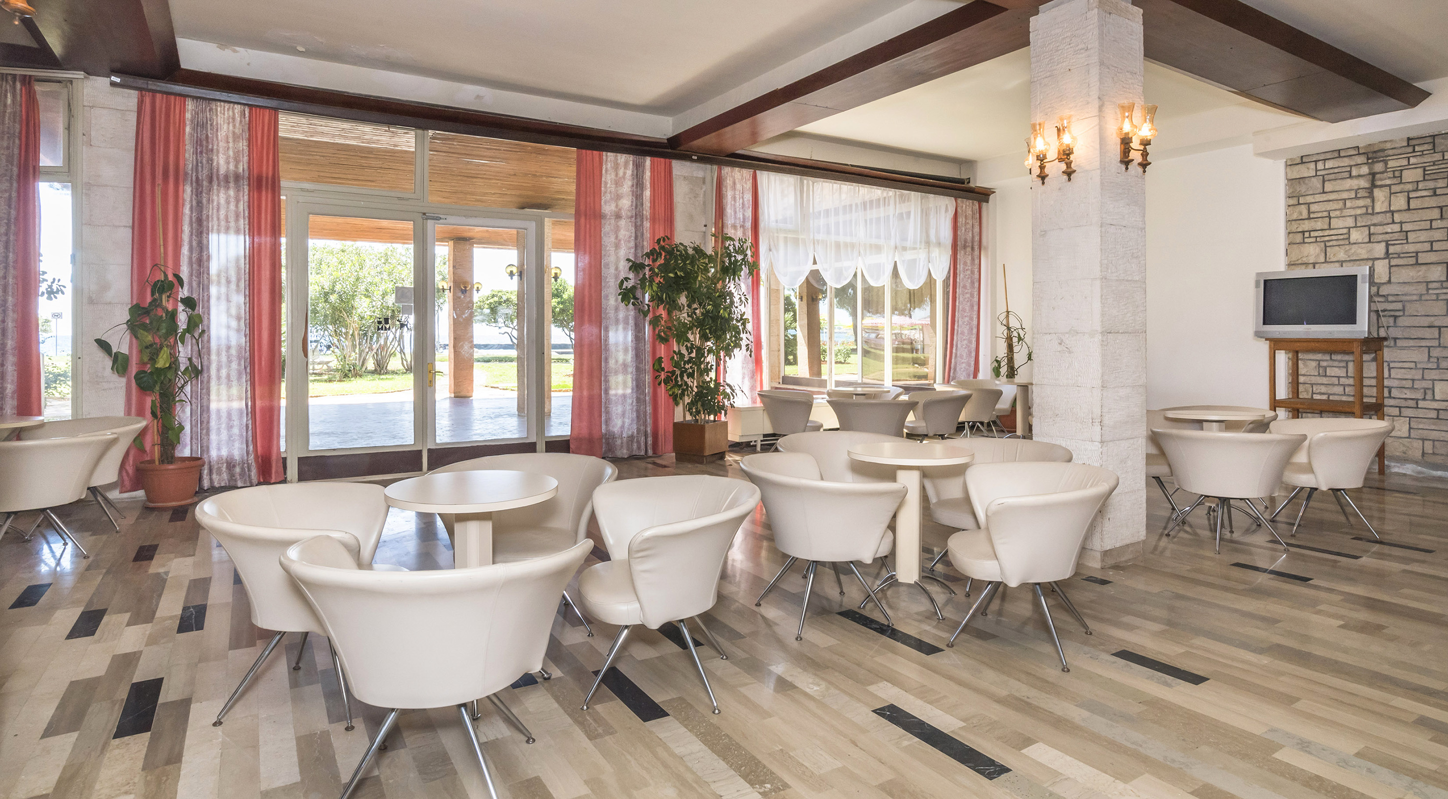 a room with tables and chairs