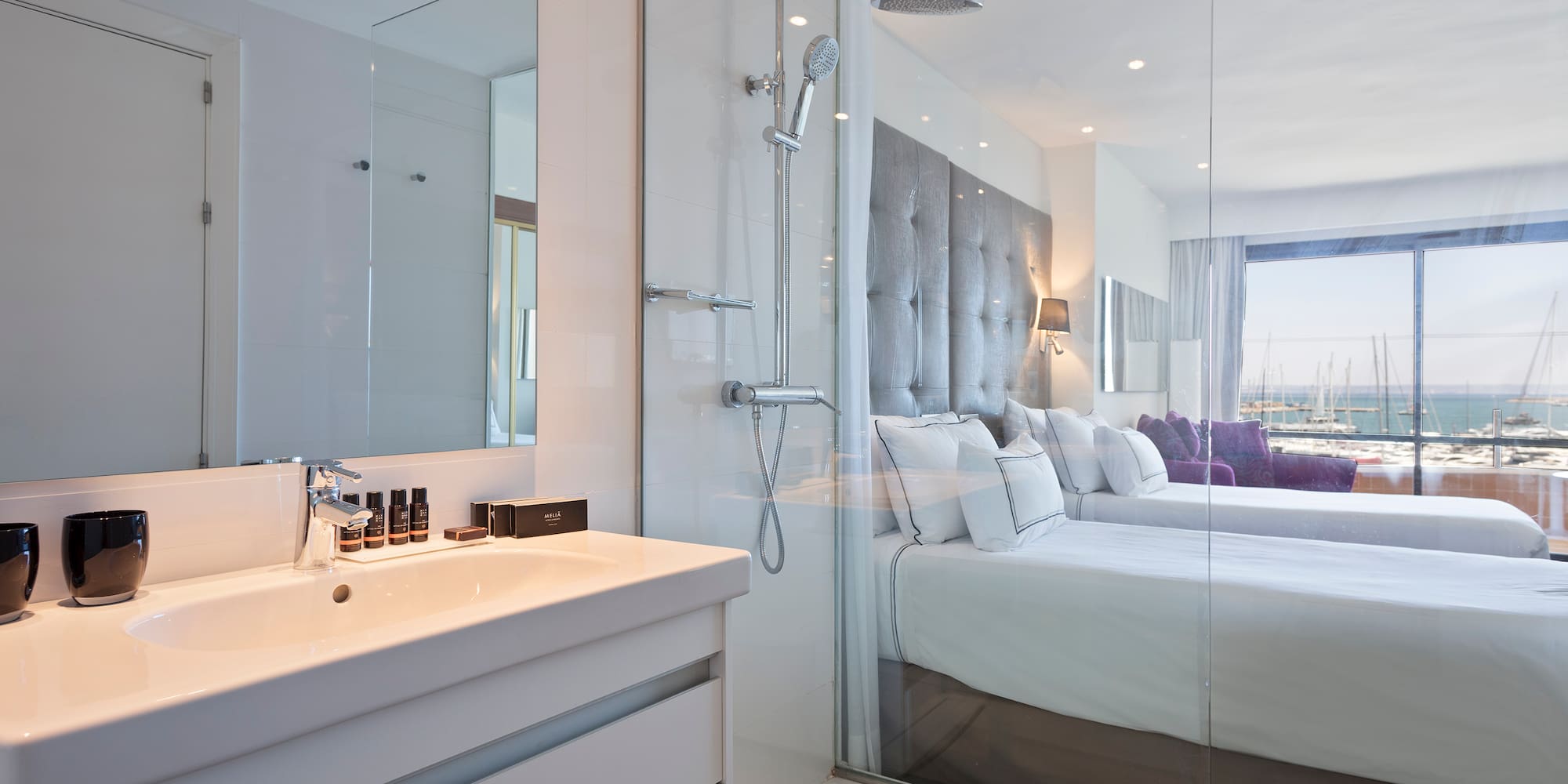 a bathroom with a shower and a bed