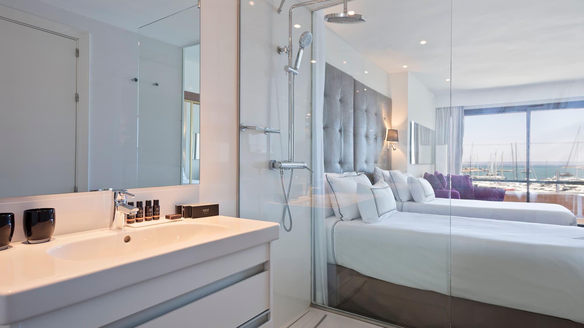 a bathroom with a shower and a bed