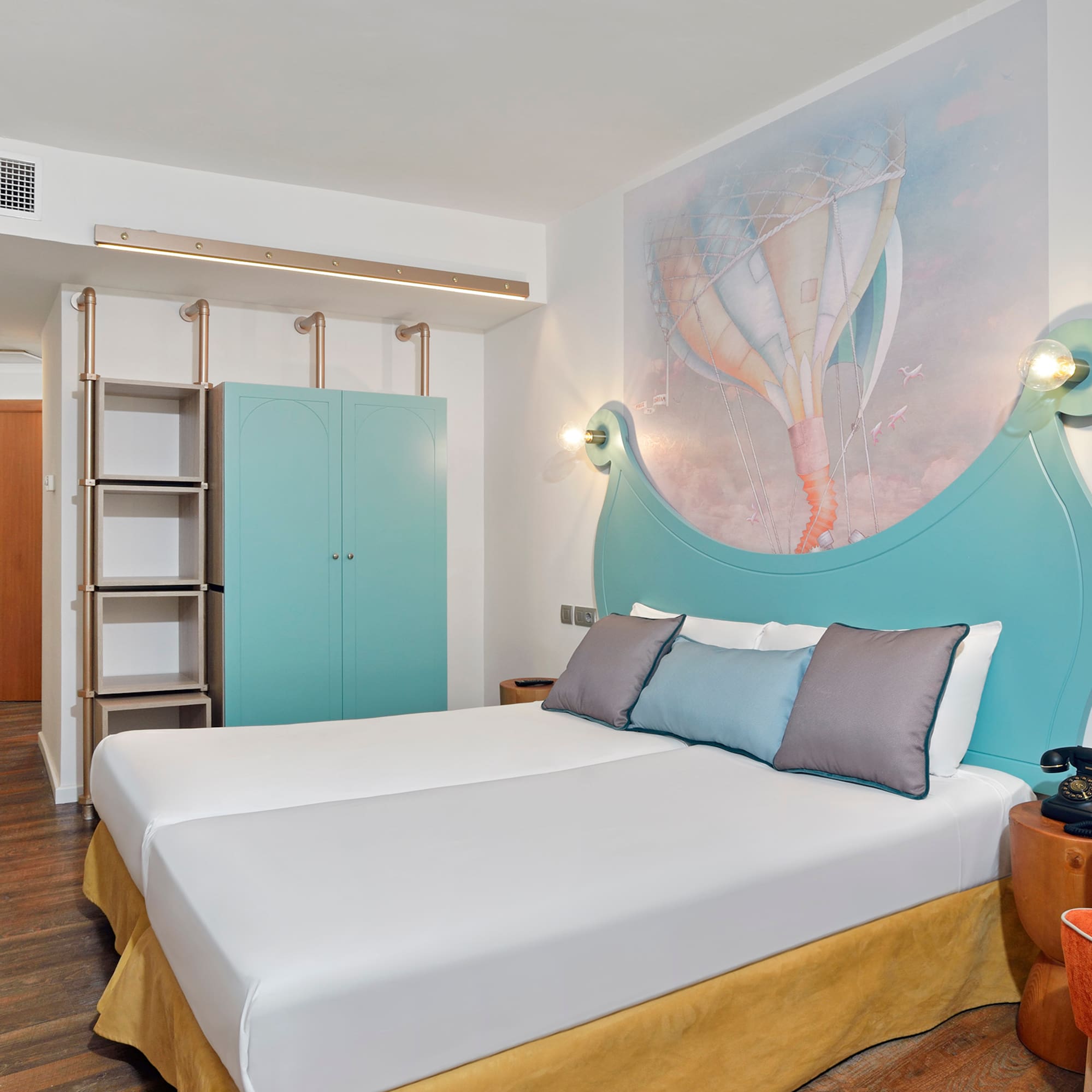 a room with a bed and a picture on the wall