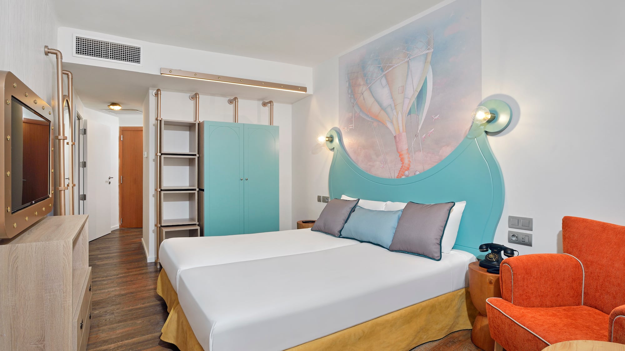 a room with a bed and a picture on the wall