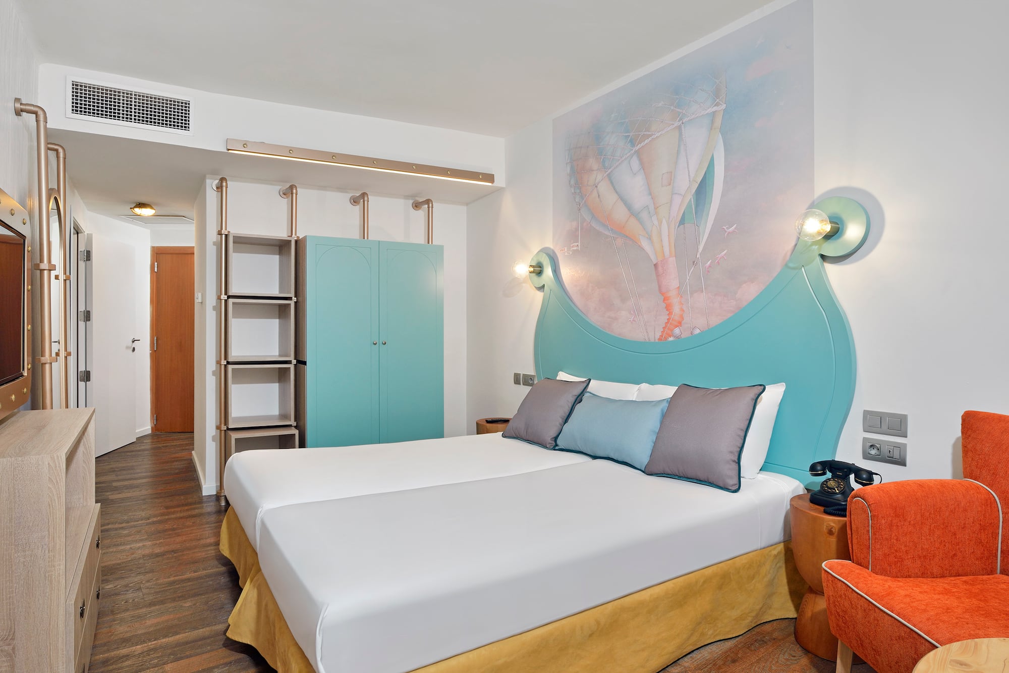 a room with a bed and a picture on the wall