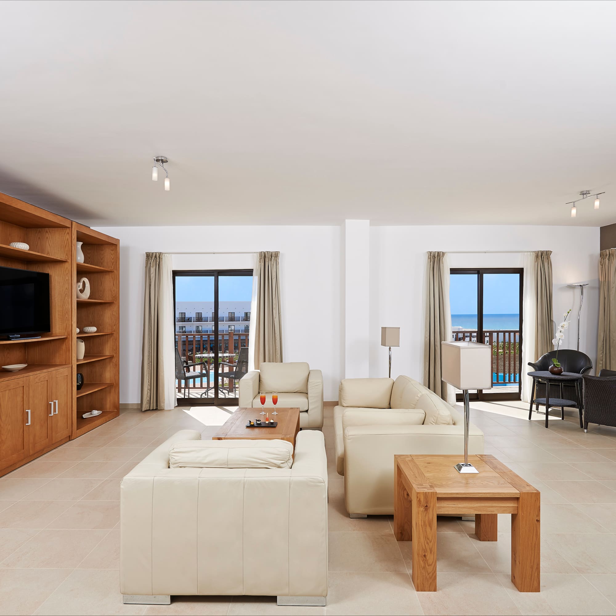 a living room with a television and a couch