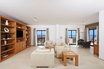 a living room with a television and a couch