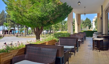 a row of chairs and tables on a patio