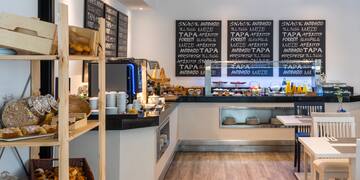 a restaurant with blackboards on the wall