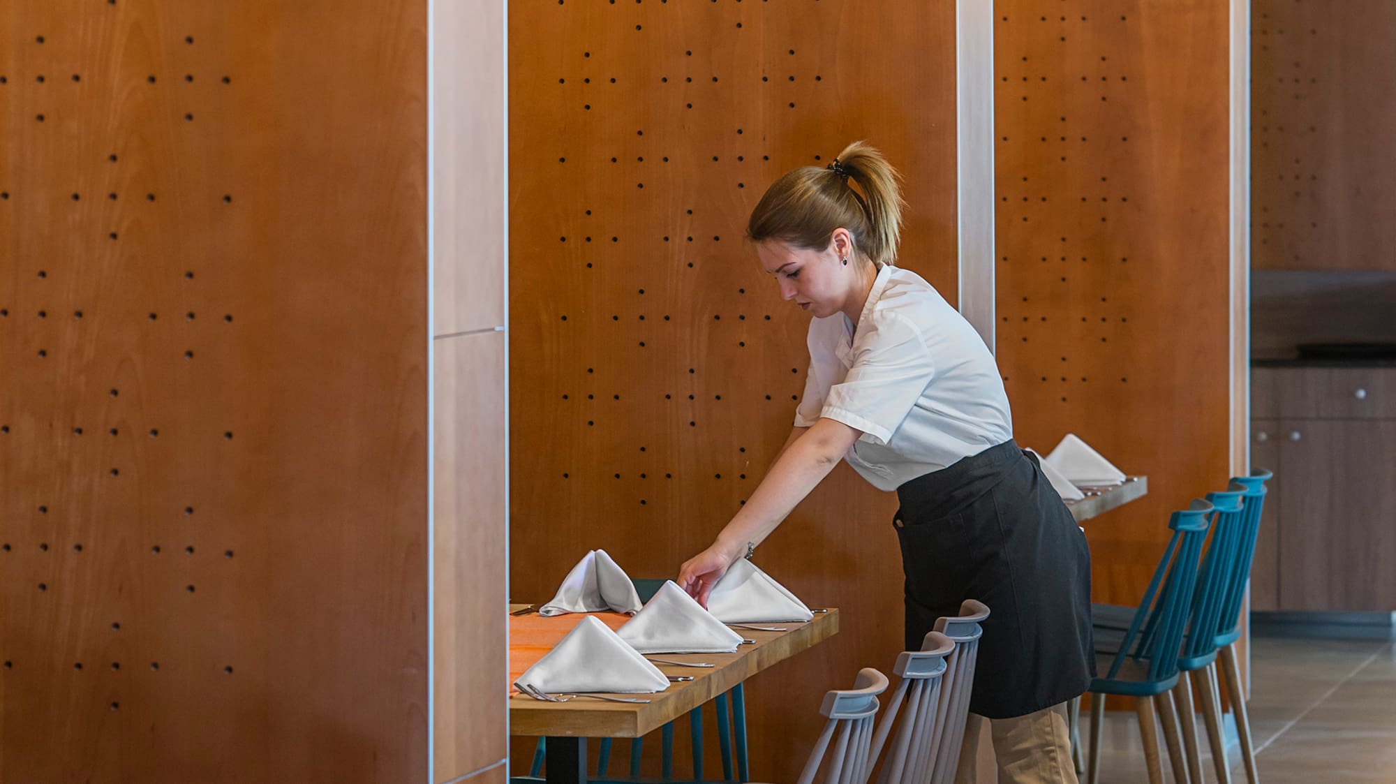 a woman in a restaurant setting