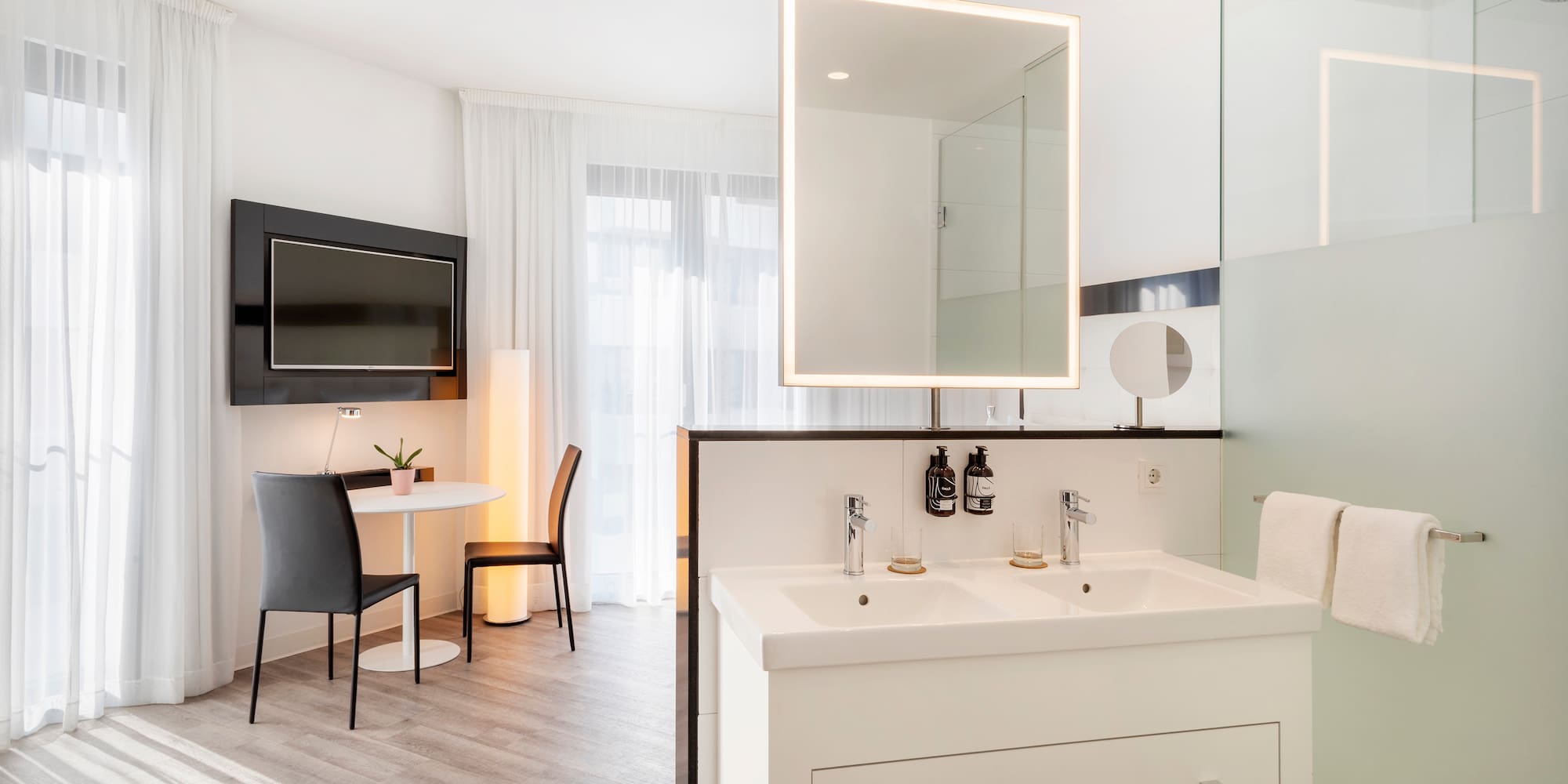 a bathroom with a mirror and a table