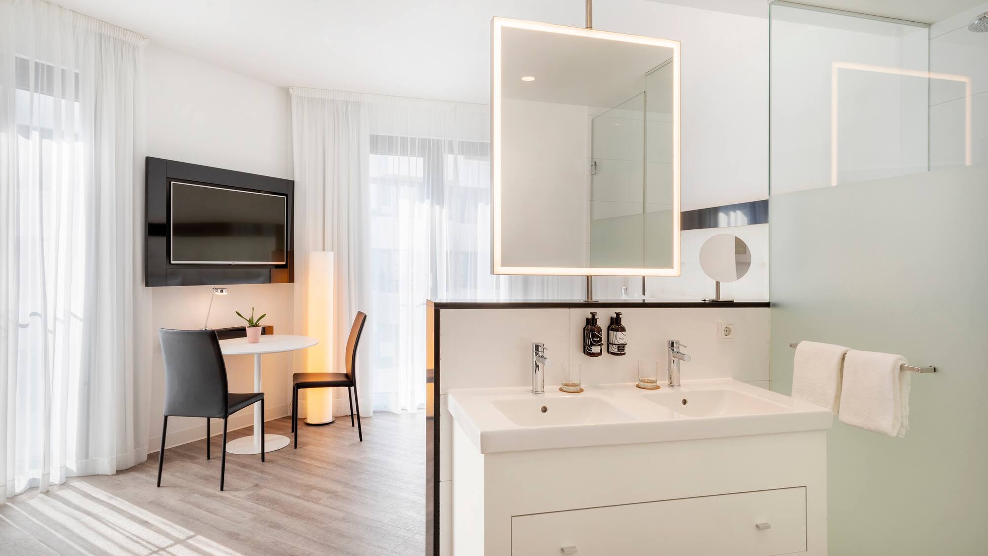 a bathroom with a mirror and a table