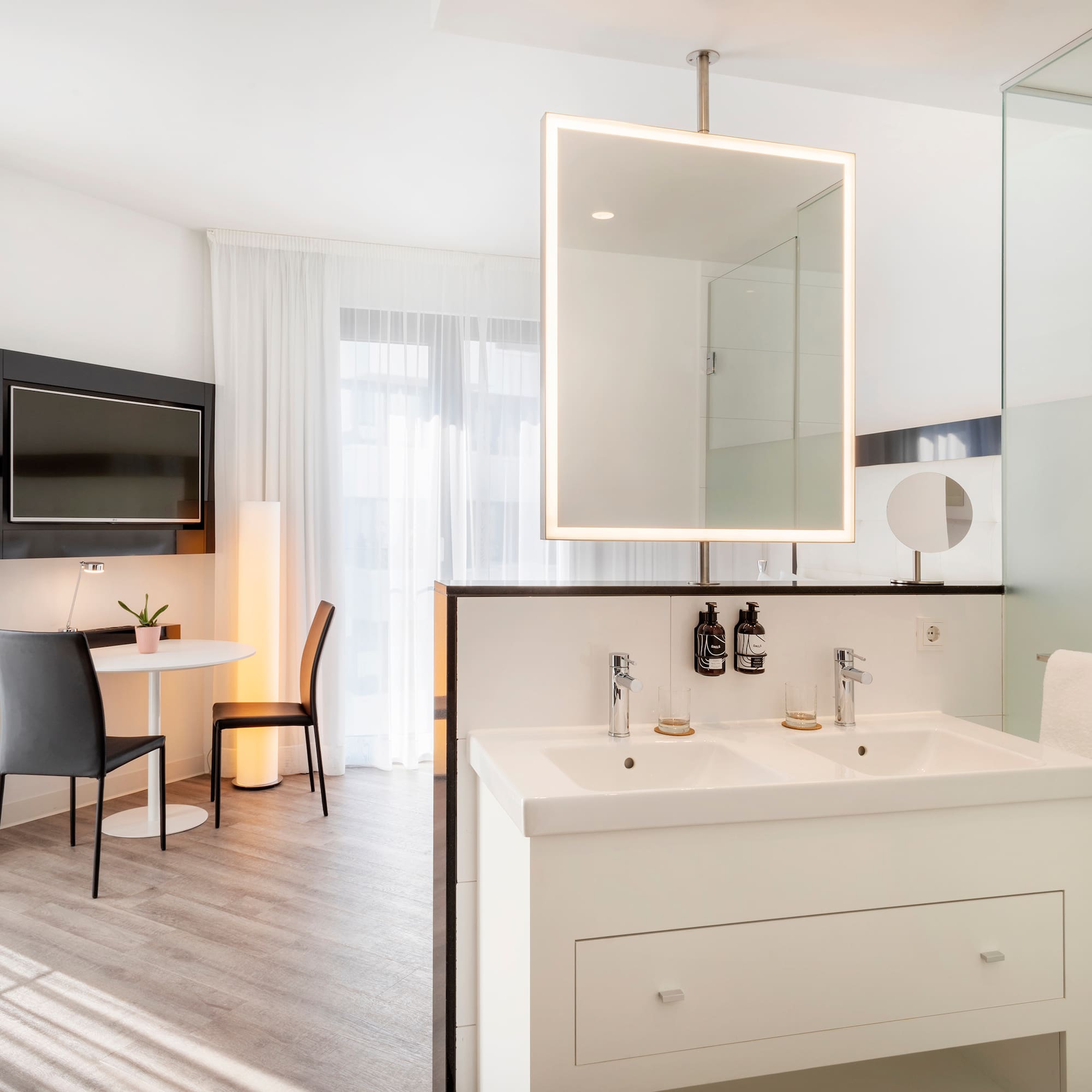 a bathroom with a mirror and a table