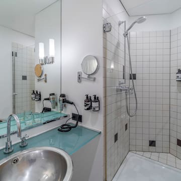 a bathroom with a sink and shower