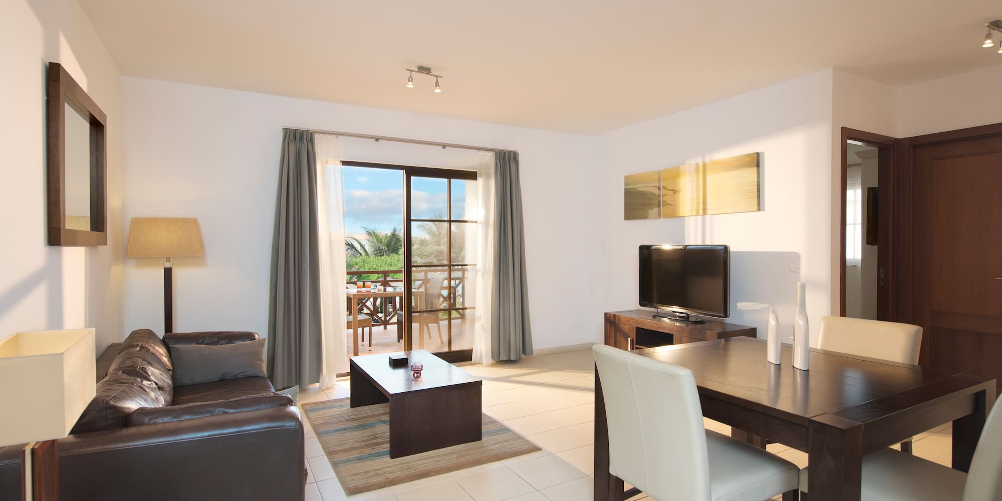 a living room with a television and a table