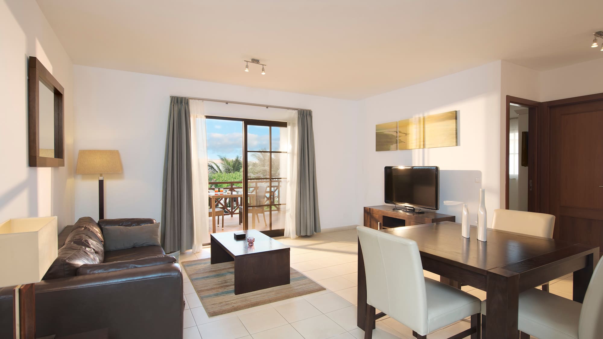 a living room with a television and a table