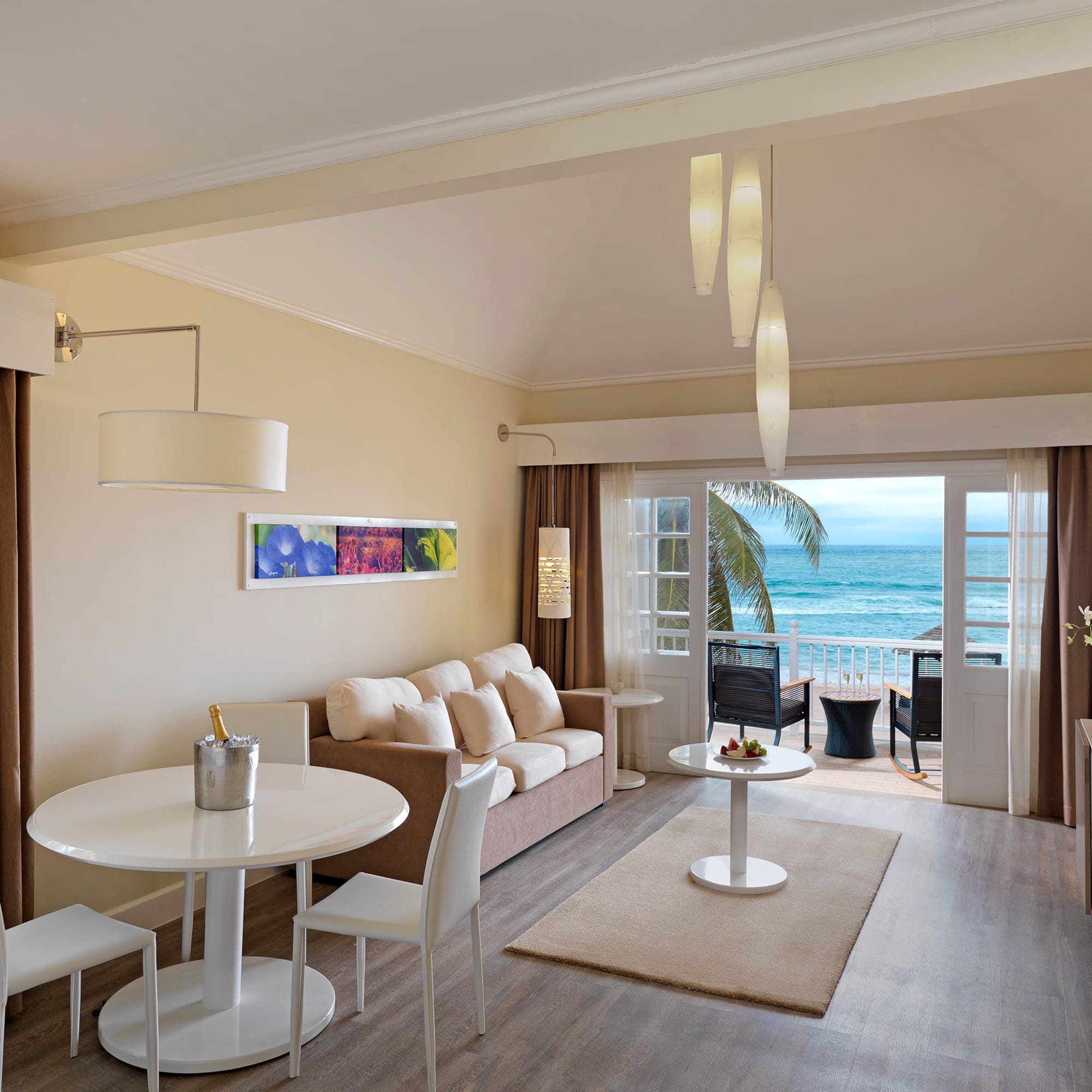 a room with a couch and a table and chairs