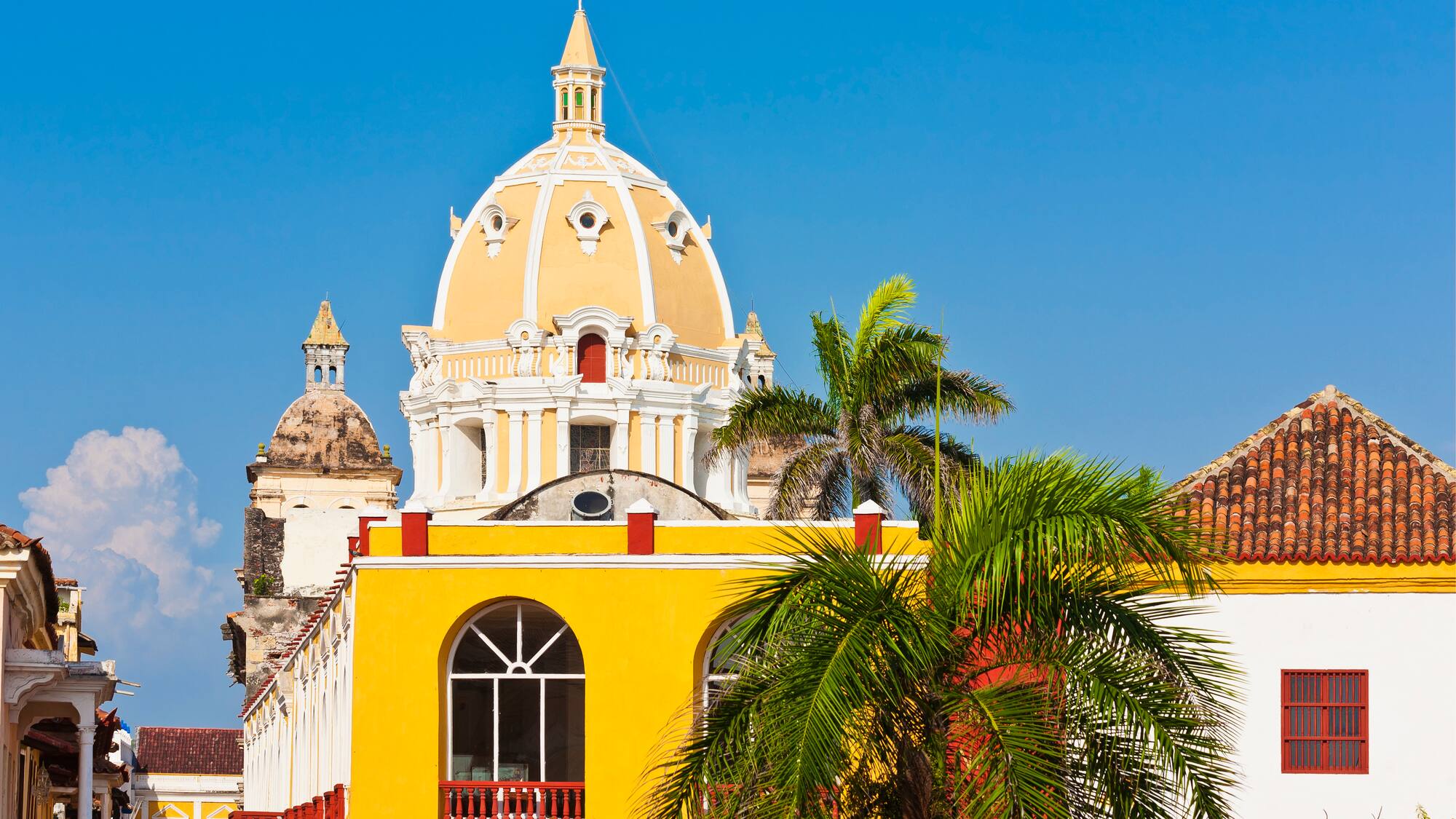 a yellow building with a dome on top